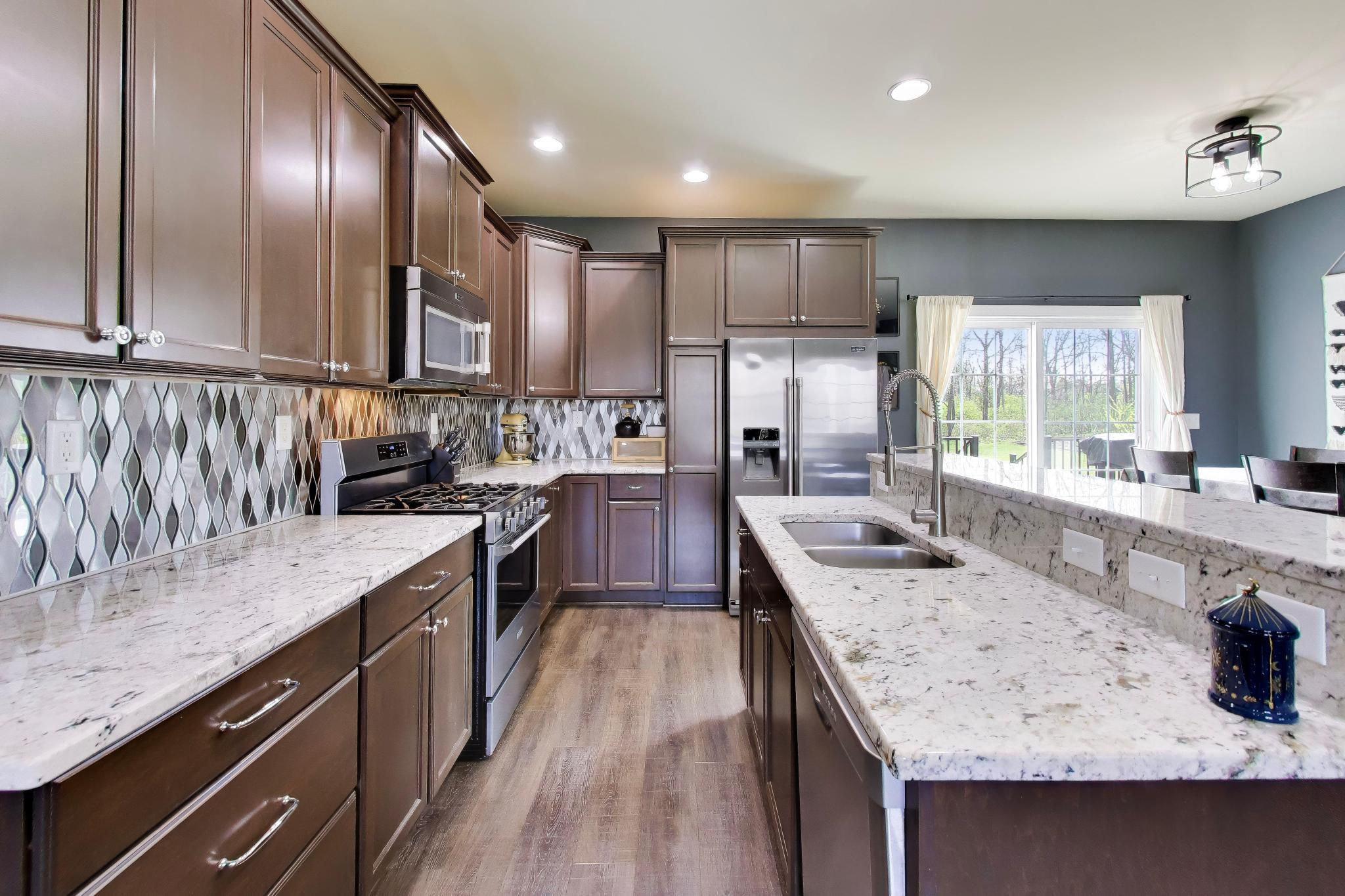 N2392 Mildred Street Delavan, WI 53115 - Photo 15 of 41 Chef's kitchen including stainless steel appliances and a new 2025 air fry convection oven.