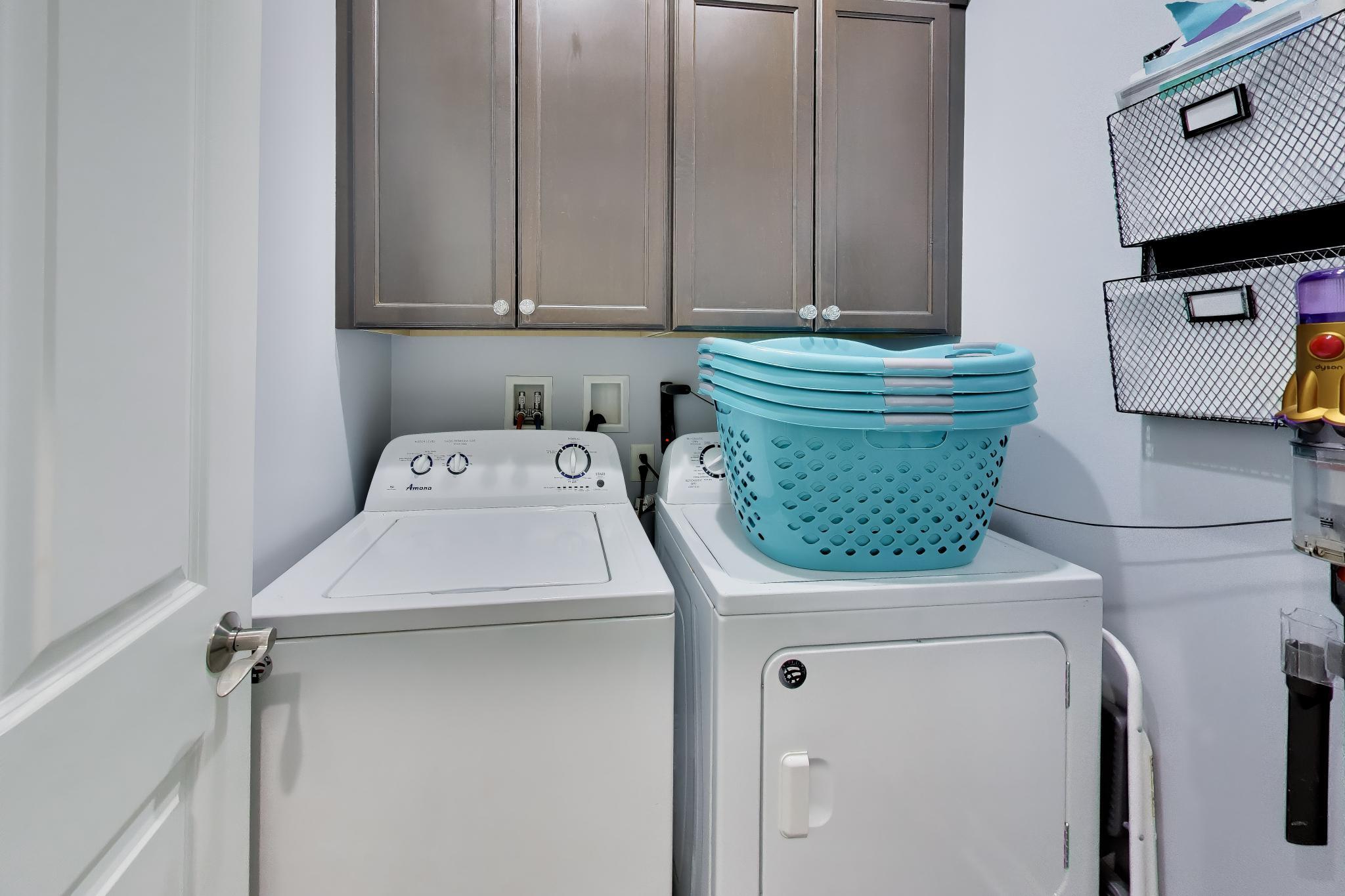 N2392 Mildred Street Delavan, WI 53115 - Photo 18 of 41 Convenient main-level laundry room with upper cabinetry for additional storage.