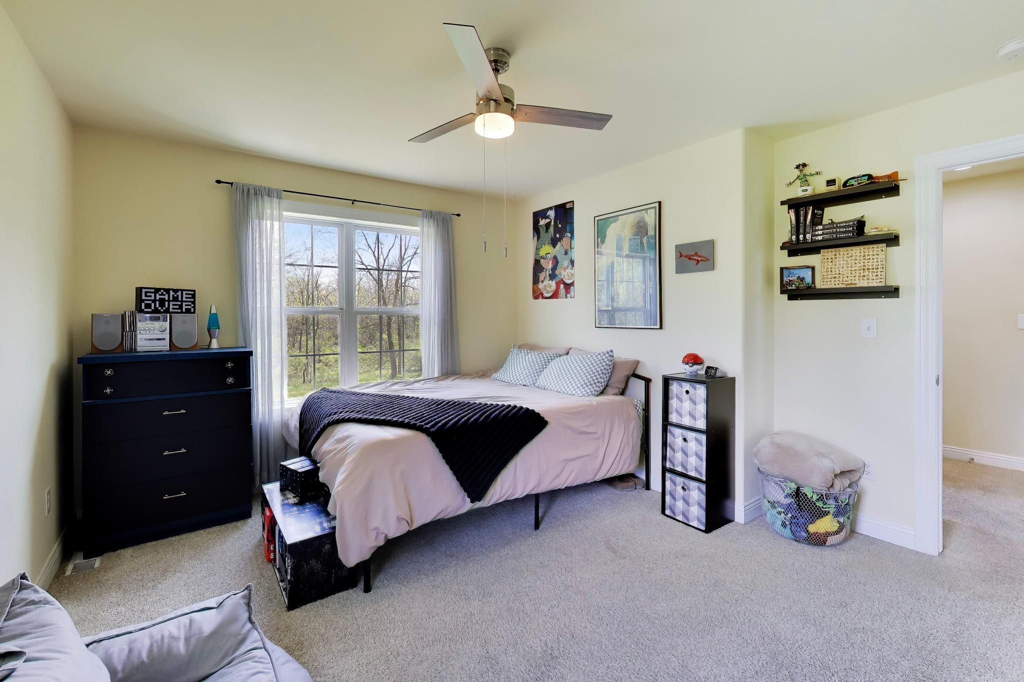 N2392 Mildred Street Delavan, WI 53115 - Photo 22 of 41 Bedroom 2 with views of the backyard.