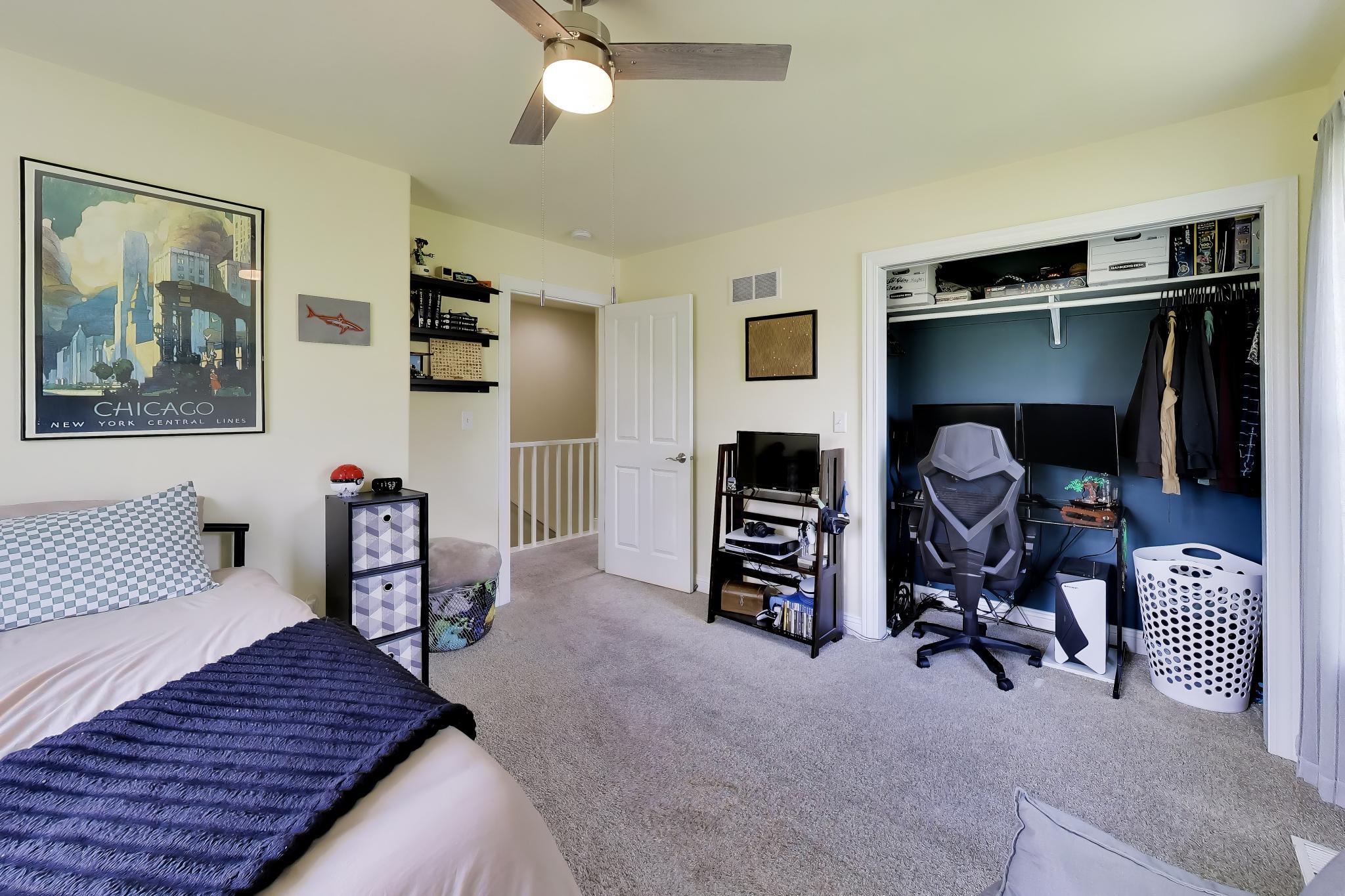 N2392 Mildred Street Delavan, WI 53115 - Photo 23 of 41 Well-proportioned bedroom featuring a wide closet with organized workspace potential.