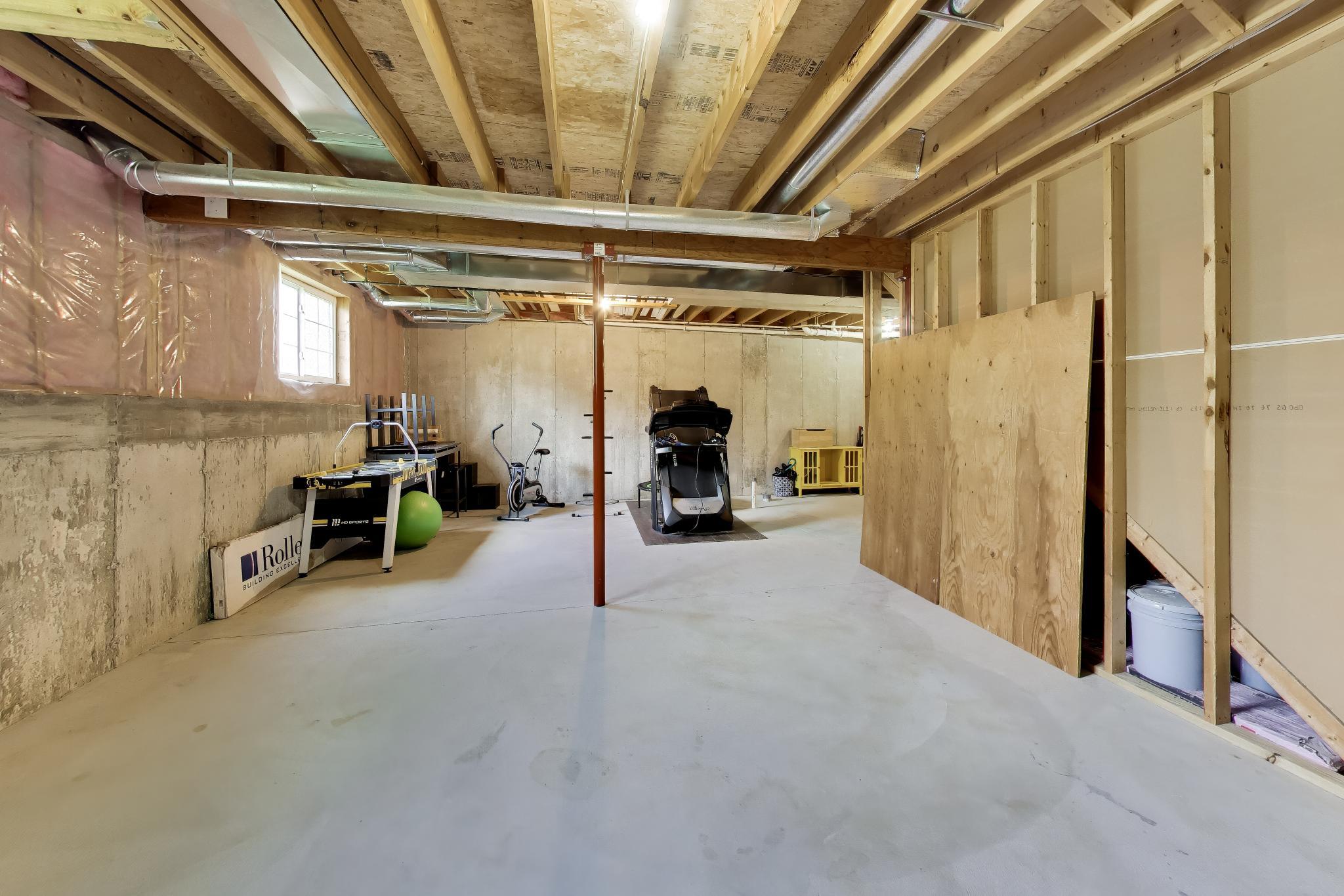 N2392 Mildred Street Delavan, WI 53115 - Photo 26 of 41 Massive unfinished lower level offering 1,046 sq ft of storage or future living space.