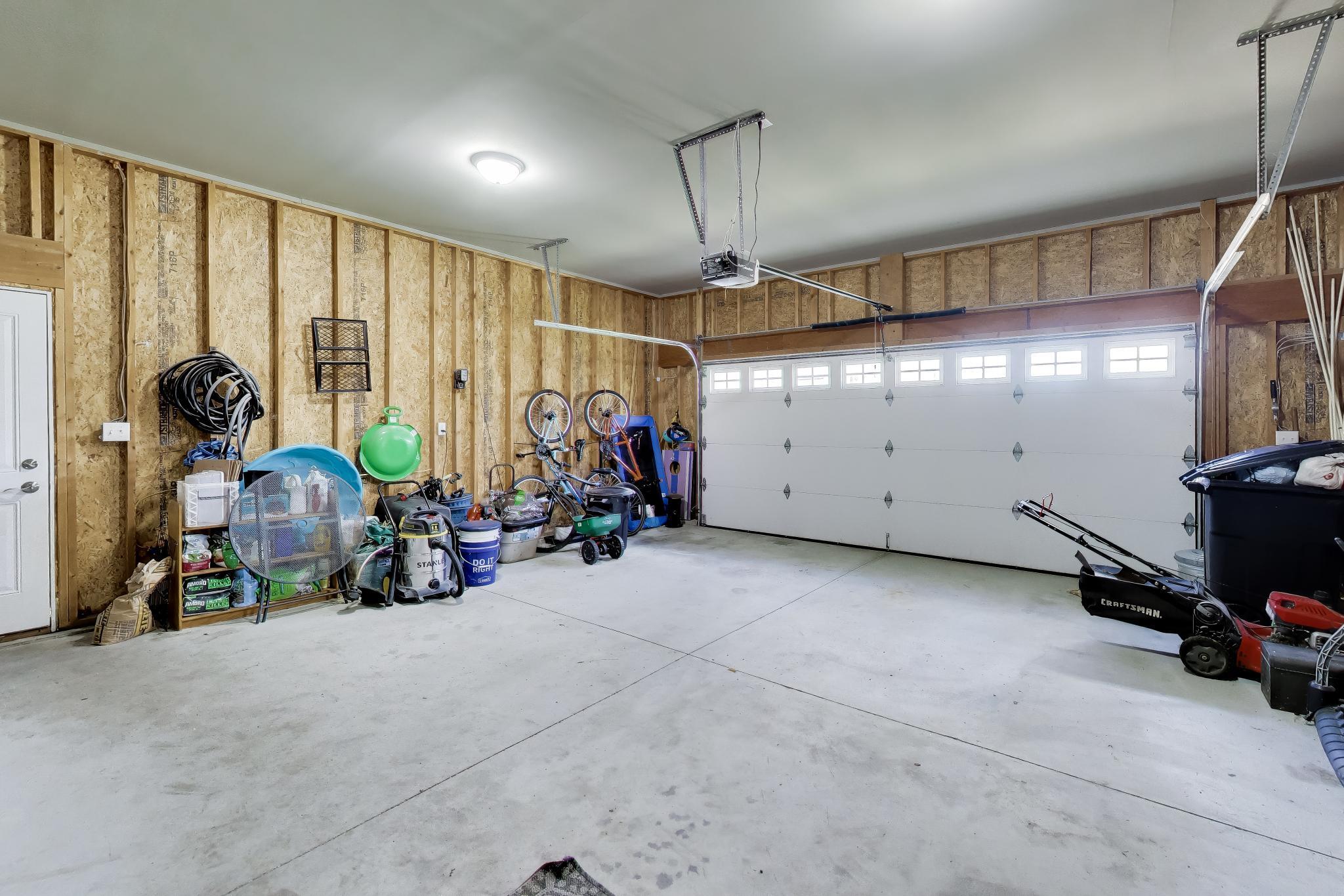 N2392 Mildred Street Delavan, WI 53115 - Photo 37 of 41 Clean, spacious 2-car attached garage with direct access to the fenced dog run.