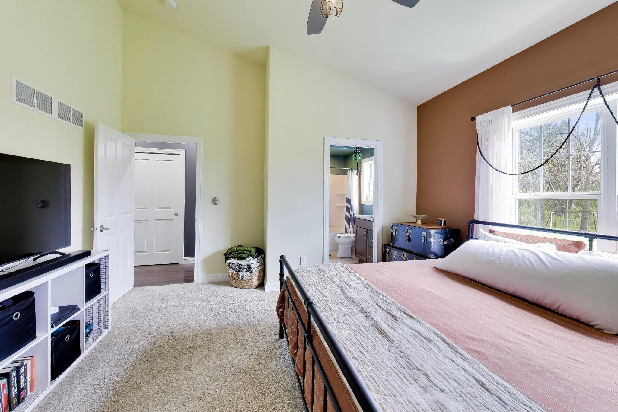 N2392 Mildred Street Delavan, WI 53115 - Photo 8 of 41 Serene primary suite with direct access to an en suite bathroom.