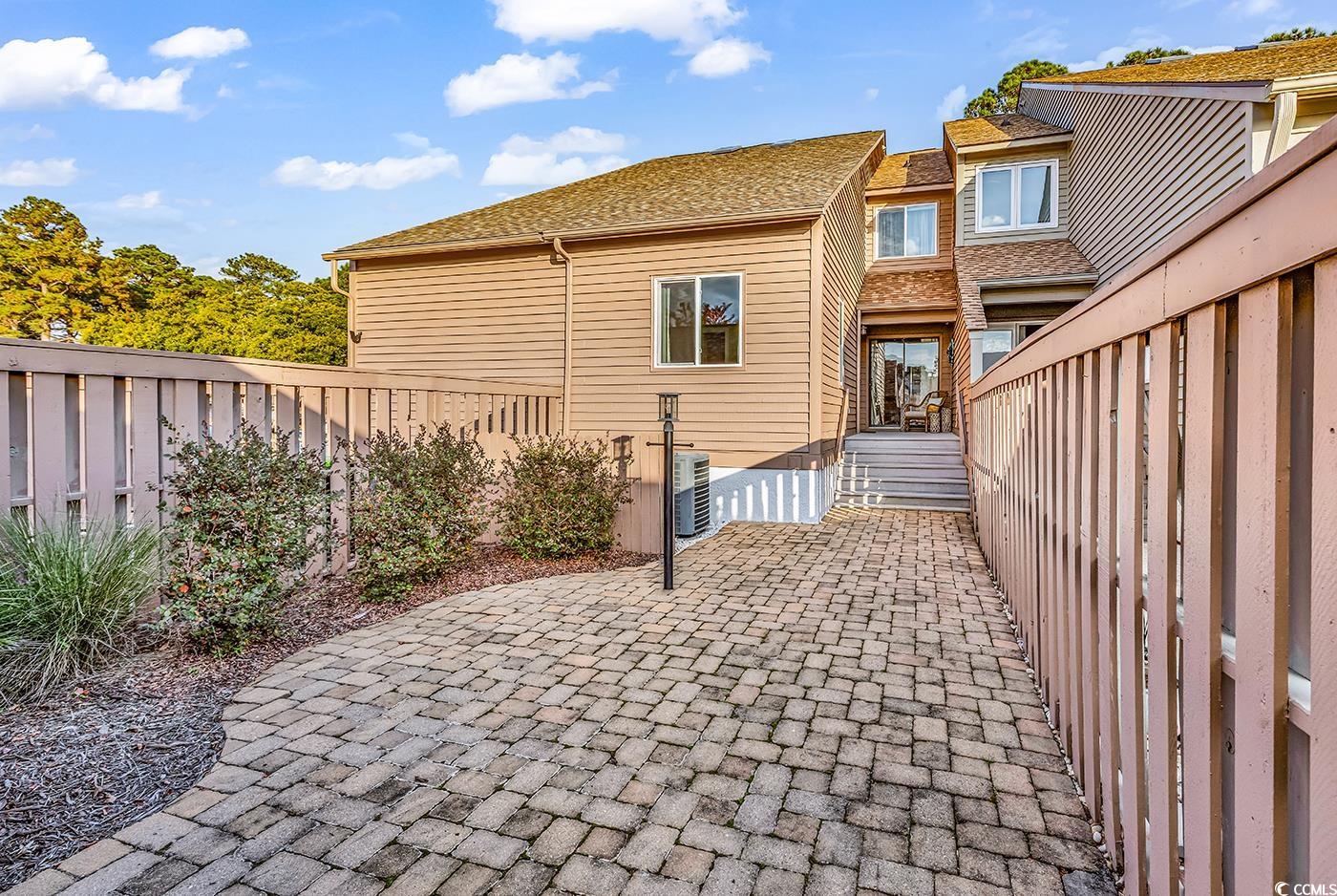 Fenced backyard with a patio area
