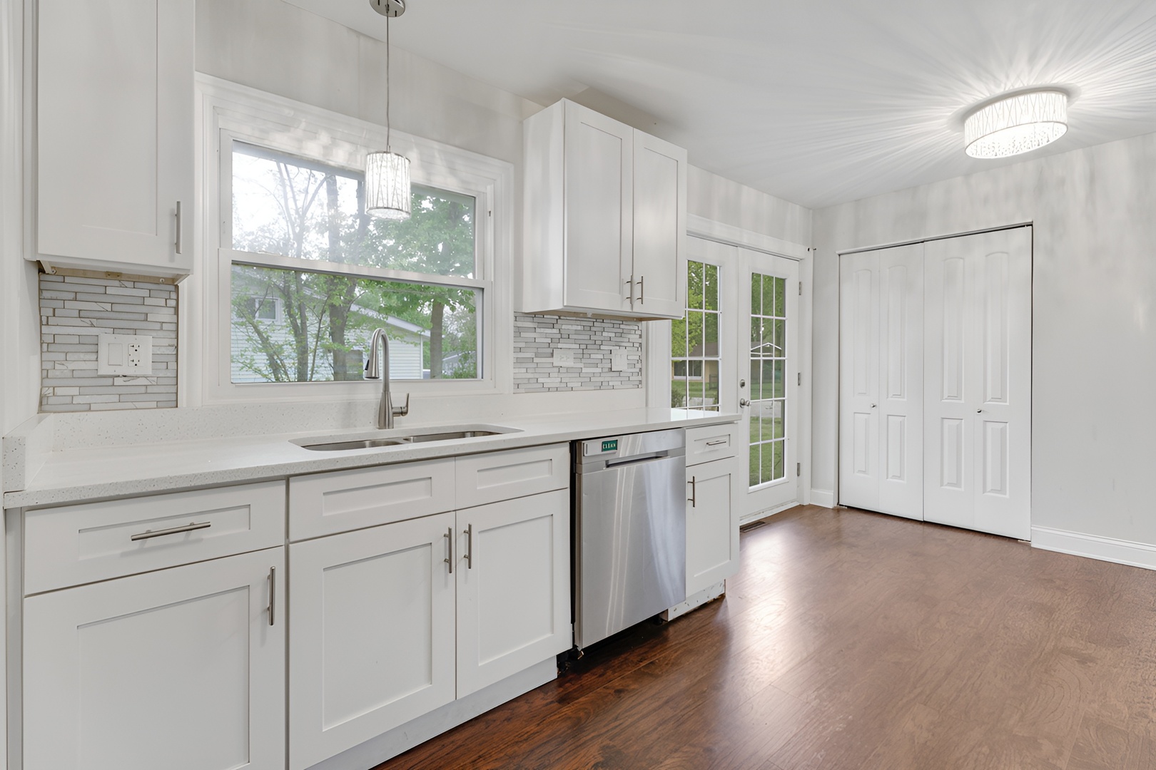 15303 Birch Road Markham, IL 60428 - Photo 12 of 20 a kitchen with sink cabinets and window