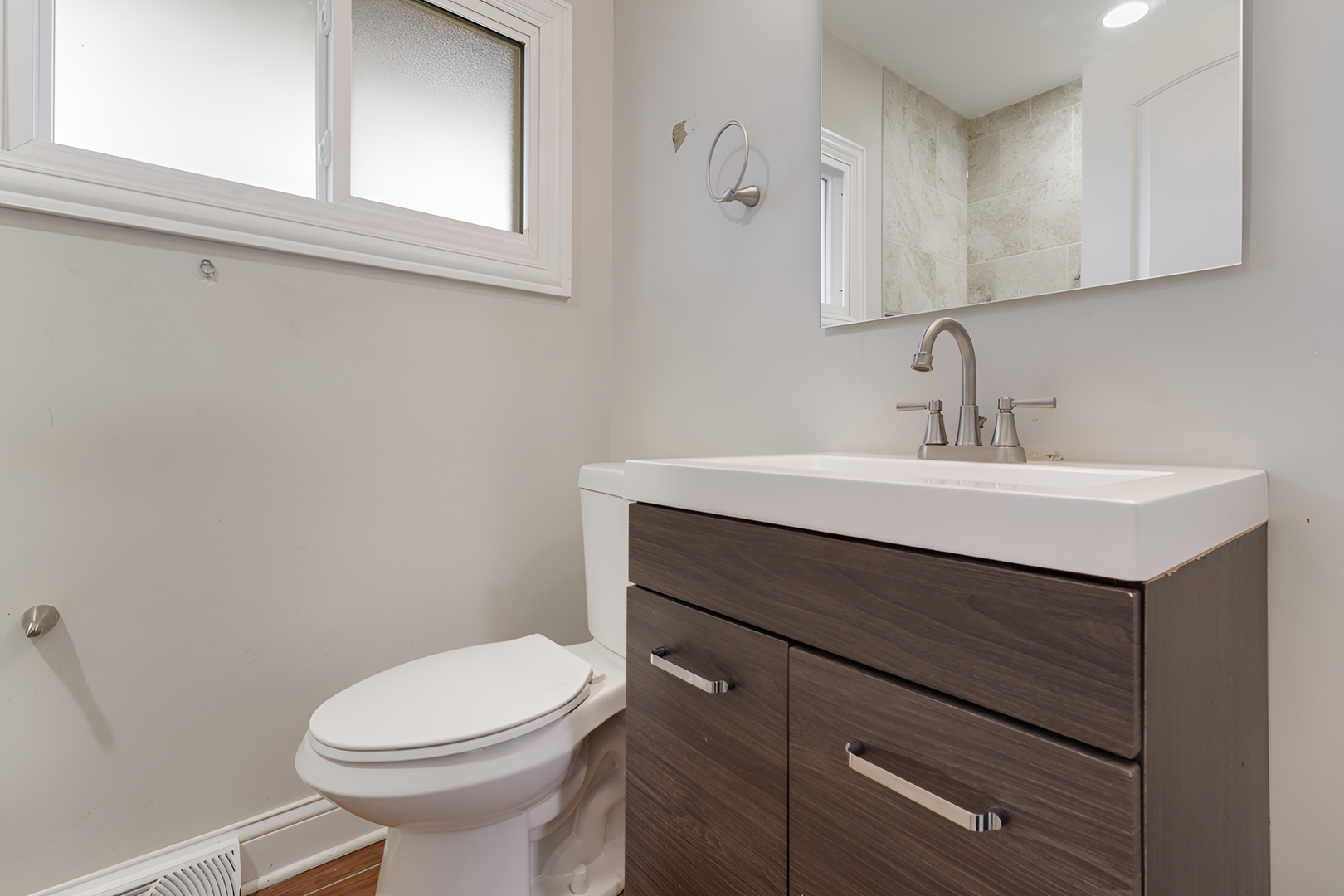 15303 Birch Road Markham, IL 60428 - Photo 14 of 20 a bathroom with a sink mirror vanity and toilet