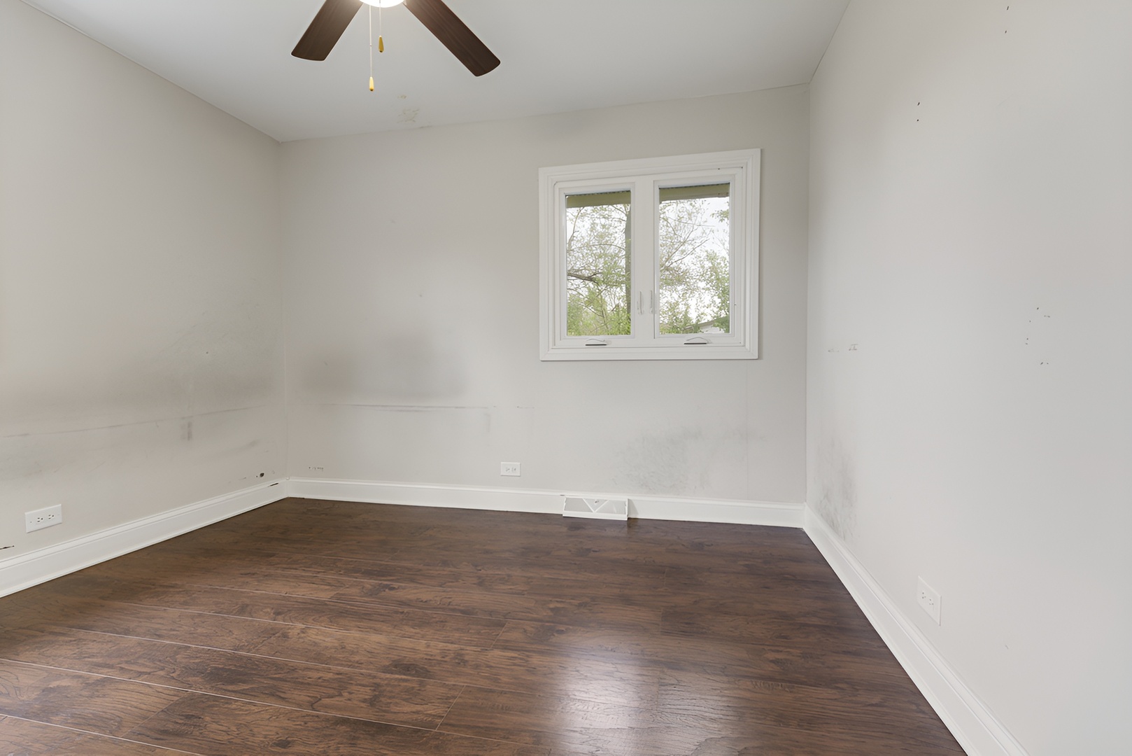 15303 Birch Road Markham, IL 60428 - Photo 16 of 20 an empty room with wooden floor and window