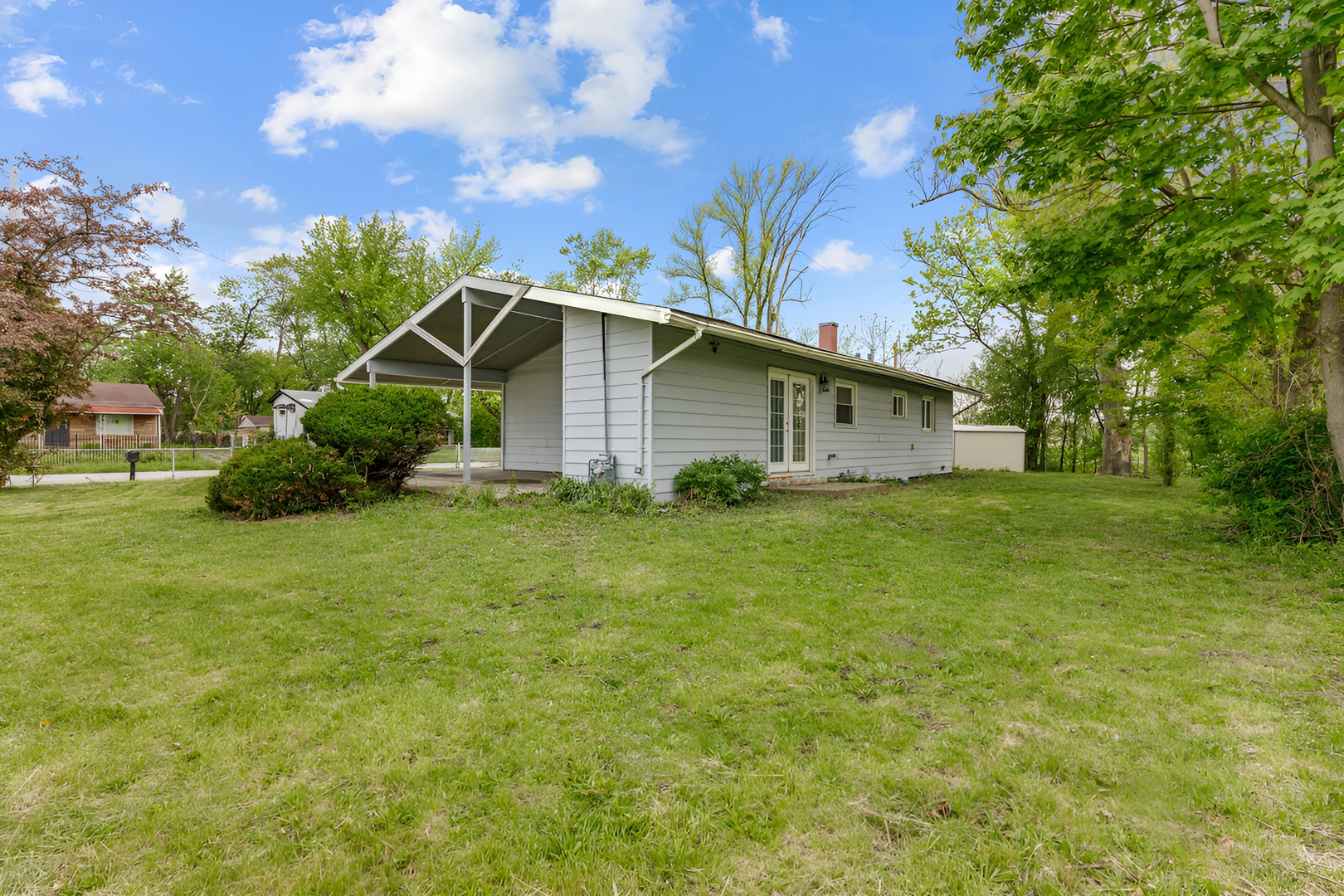 15303 Birch Road Markham, IL 60428 - Photo 18 of 20 a front view of house with garden
