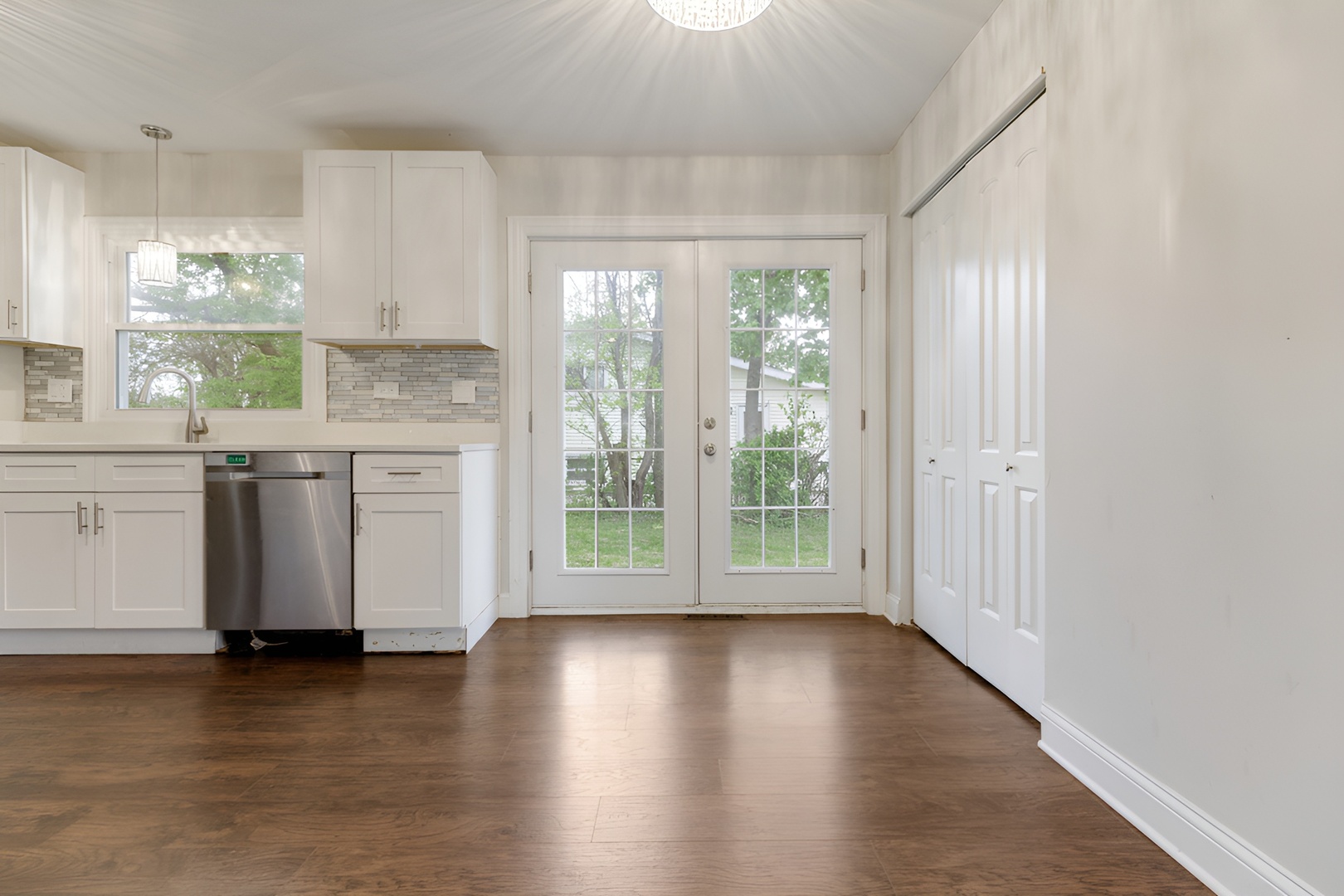 15303 Birch Road Markham, IL 60428 - Photo 7 of 20 a view of a kitchen with wooden floor and a window