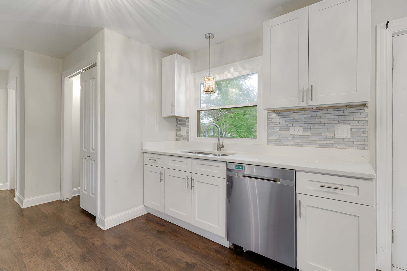15303 Birch Road Markham, IL 60428 - Photo 10 of 20 a kitchen with white cabinets and sink