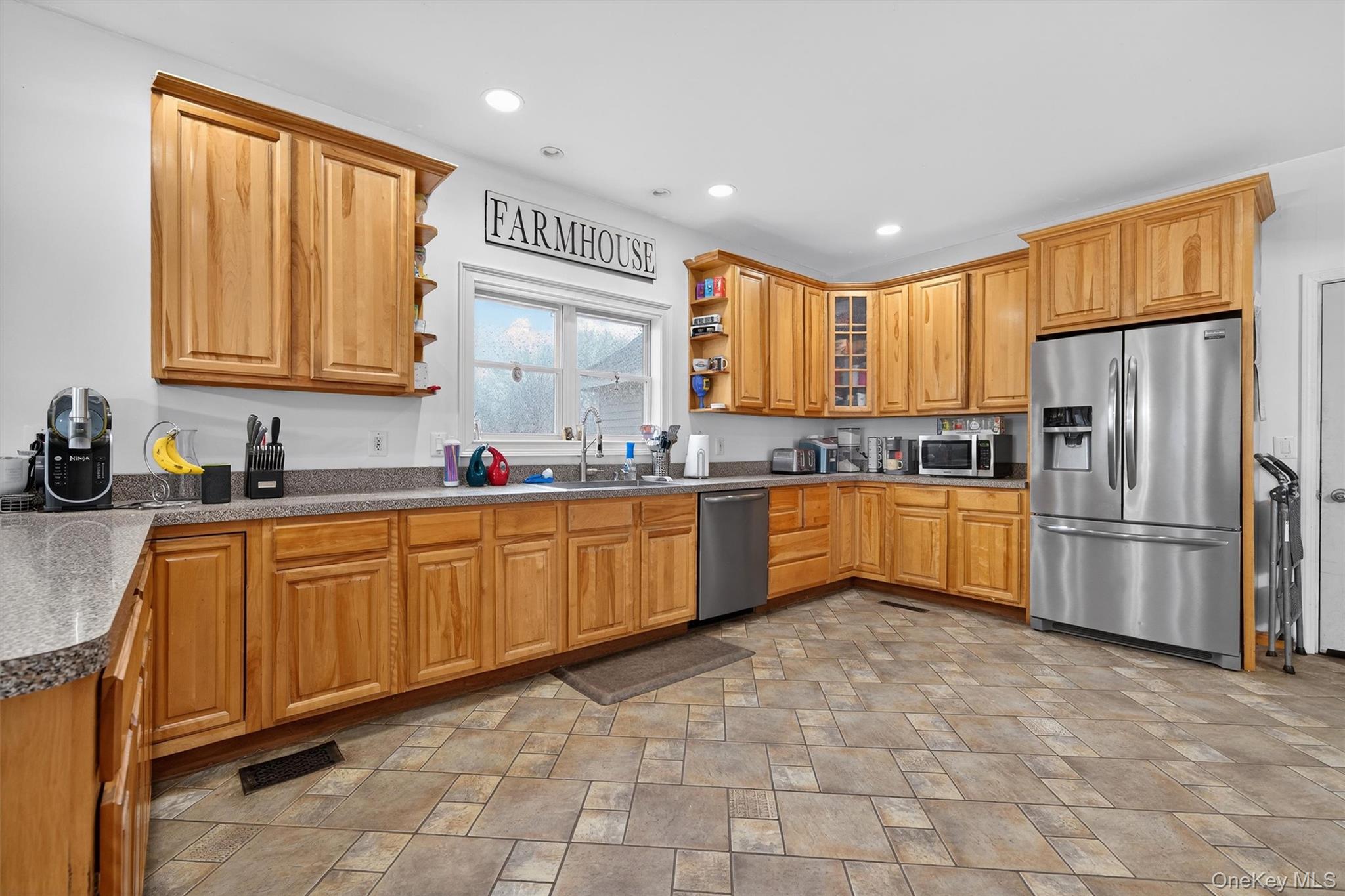 71 Eagle Crest Road Port Jervis, NY 12771 - Photo 18 of 45 Kitchen with open shelves, stainless steel appliances, dark countertops, stone finish flooring, and wood finish cabinets