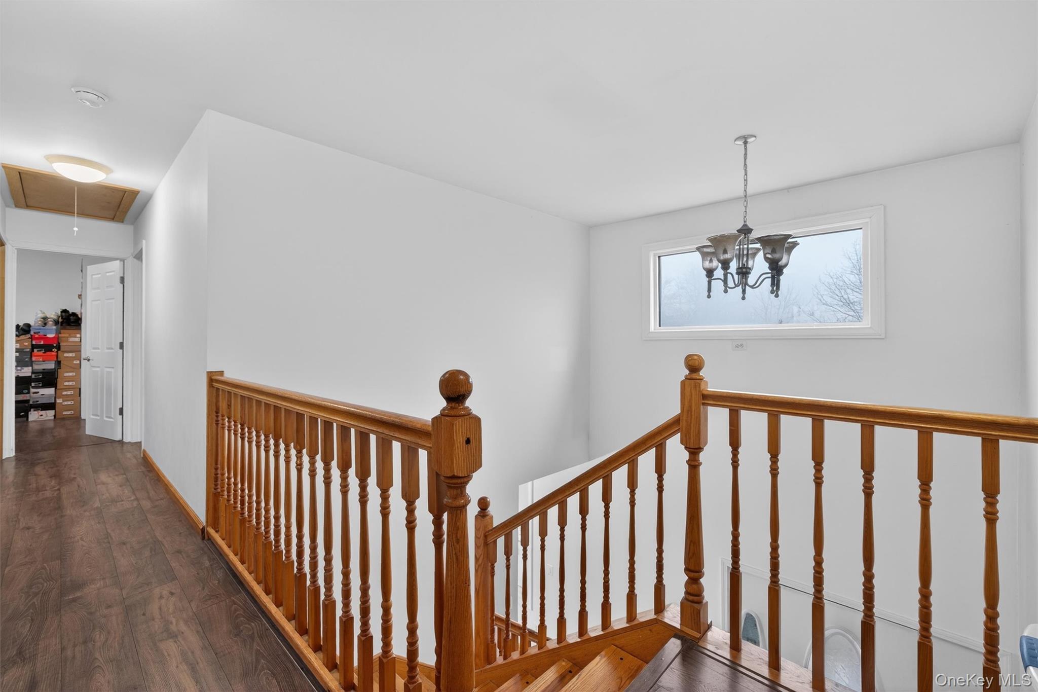 71 Eagle Crest Road Port Jervis, NY 12771 - Photo 24 of 45 Hall featuring wood finished floors, an upstairs landing, and hanging lights