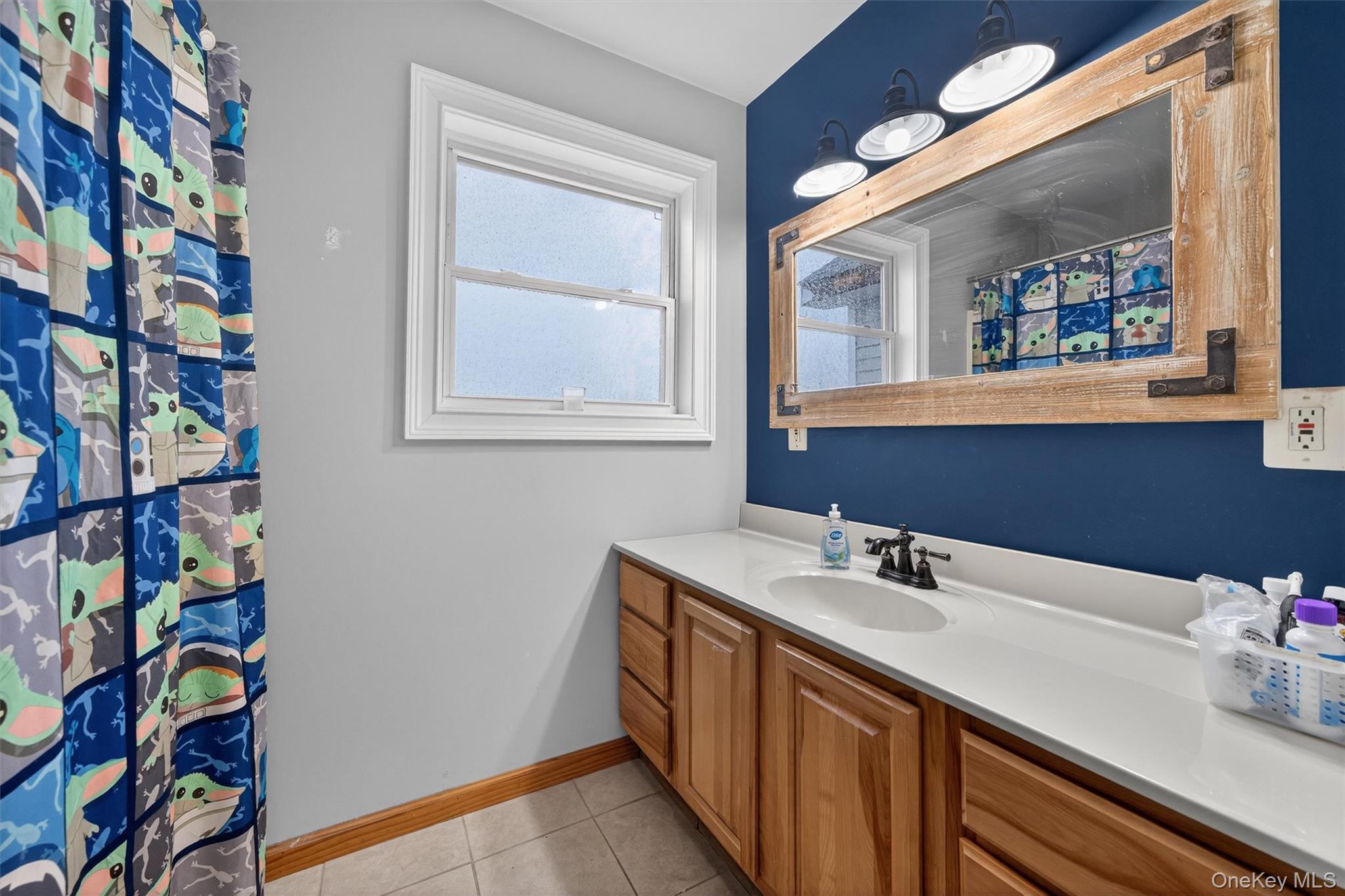 71 Eagle Crest Road Port Jervis, NY 12771 - Photo 30 of 45 Bathroom with a shower with shower curtain, vanity, and light tile patterned floors