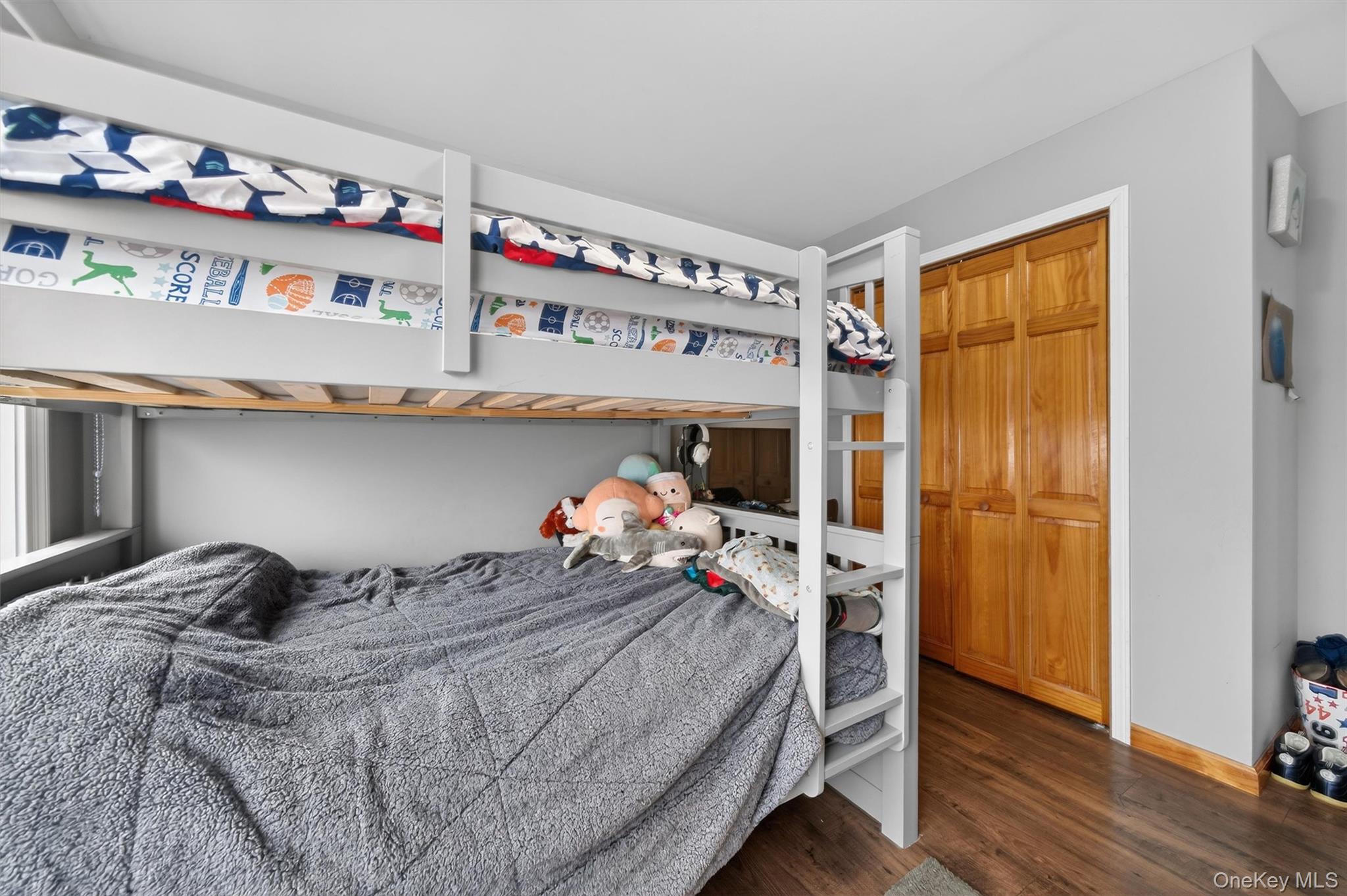 71 Eagle Crest Road Port Jervis, NY 12771 - Photo 33 of 45 Bedroom featuring dark wood-style floors and a closet