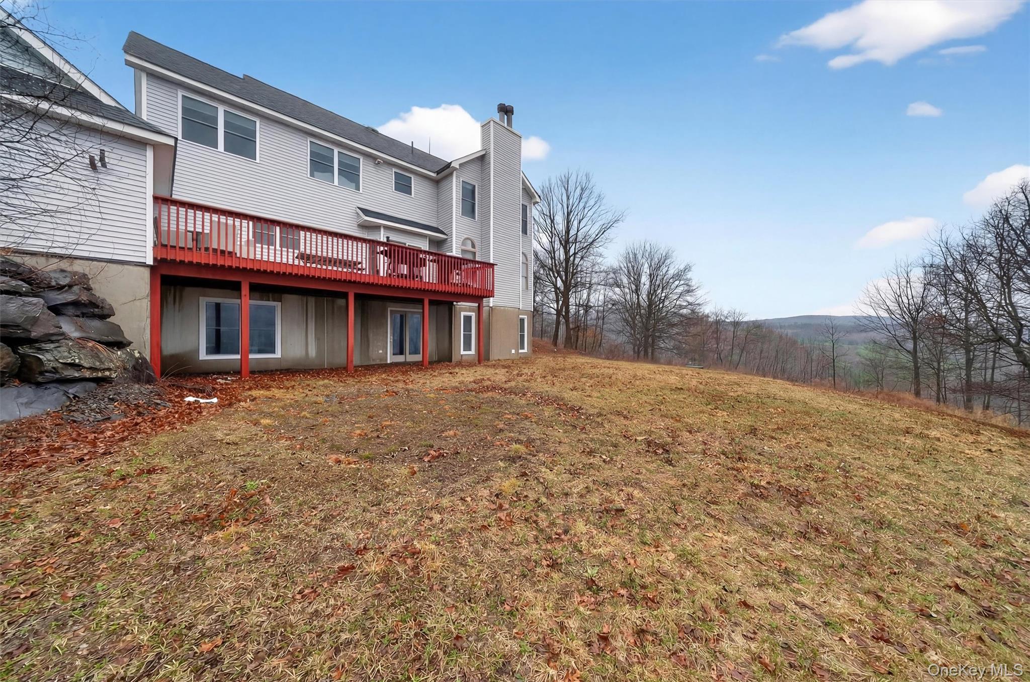 71 Eagle Crest Road Port Jervis, NY 12771 - Photo 41 of 45 Back of property with a wooden deck and a chimney