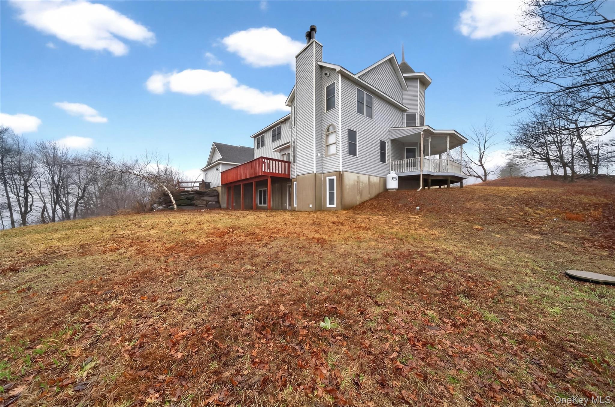 71 Eagle Crest Road Port Jervis, NY 12771 - Photo 42 of 45 Back of house featuring a chimney, a deck, and a yard
