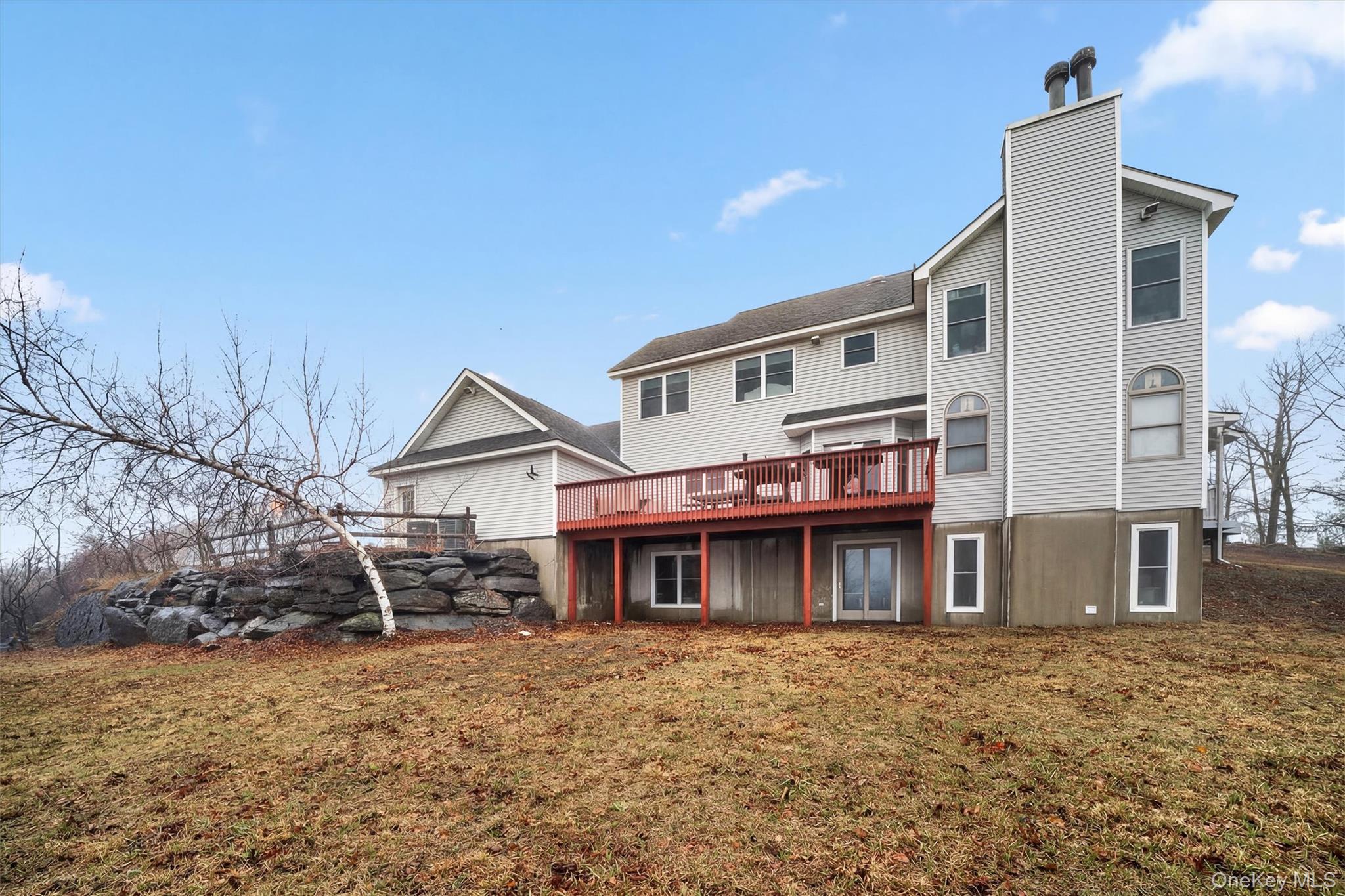 71 Eagle Crest Road Port Jervis, NY 12771 - Photo 43 of 45 Back of property with a deck, a lawn, and a chimney