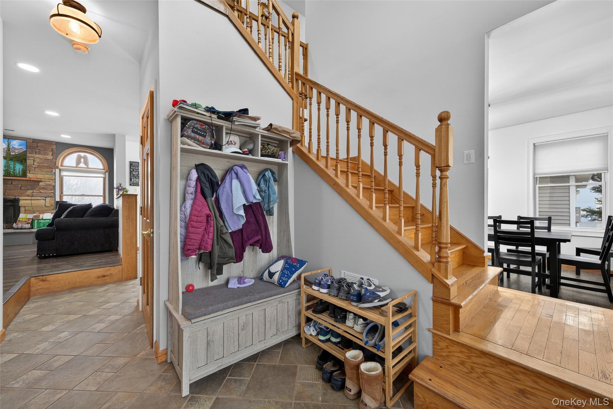 71 Eagle Crest Road Port Jervis, NY 12771 - Photo 6 of 45 Mudroom with recessed lighting, a stone fireplace, and dark stone finish floors