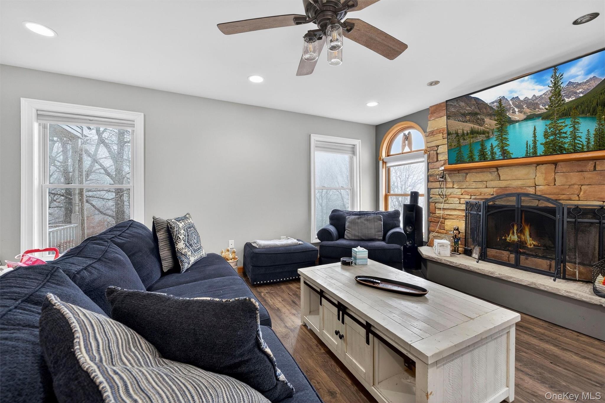 71 Eagle Crest Road Port Jervis, NY 12771 - Photo 8 of 45 Living area featuring dark wood-type flooring, a fireplace, ceiling fan, and recessed lighting