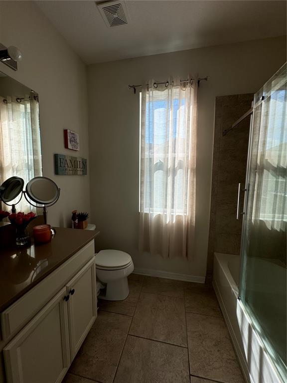14645 Magnolia Ridge Loop Winter Garden, FL 34787 - Photo 13 of 20 a bathroom with a granite countertop sink toilet and shower