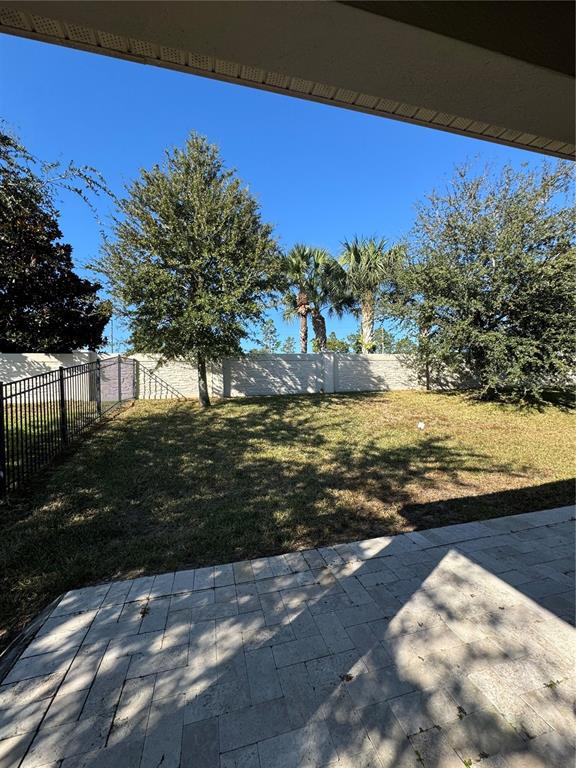 14645 Magnolia Ridge Loop Winter Garden, FL 34787 - Photo 17 of 20 a view of a yard with a lake view