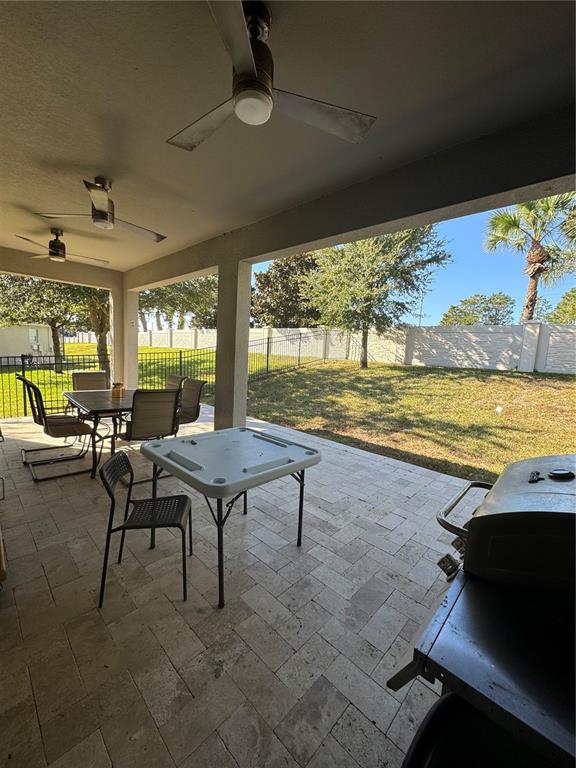 14645 Magnolia Ridge Loop Winter Garden, FL 34787 - Photo 19 of 20 a view of a patio with swimming pool
