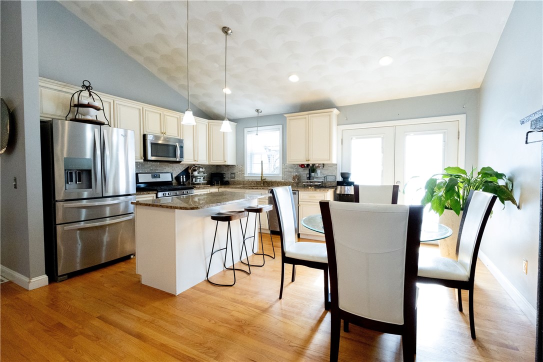 32 Dike Street Woonsocket, RI 02895 - Photo 4 of 20 The impressive kitchen boasts granite countertops, a spacious center island, and stainless steel appliances.