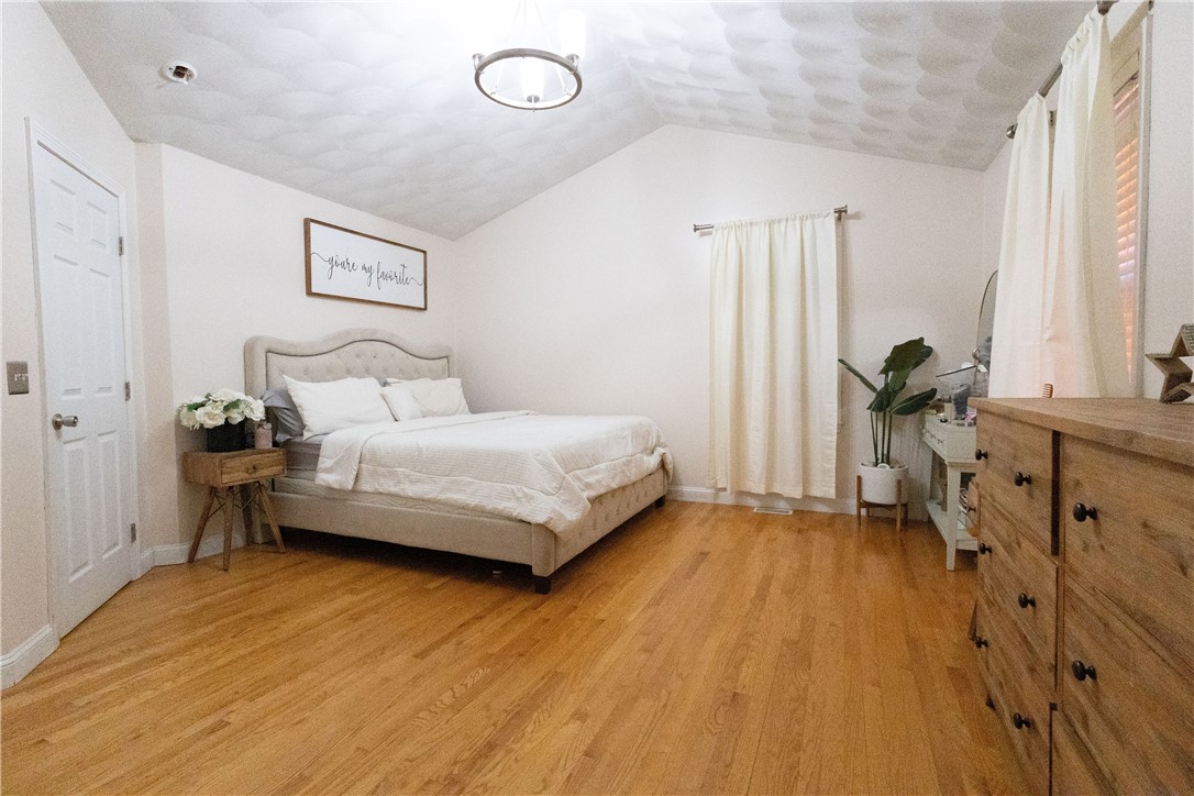 32 Dike Street Woonsocket, RI 02895 - Photo 6 of 20 The primary bedroom includes direct access to the main bathroom for added comfort and convenience.