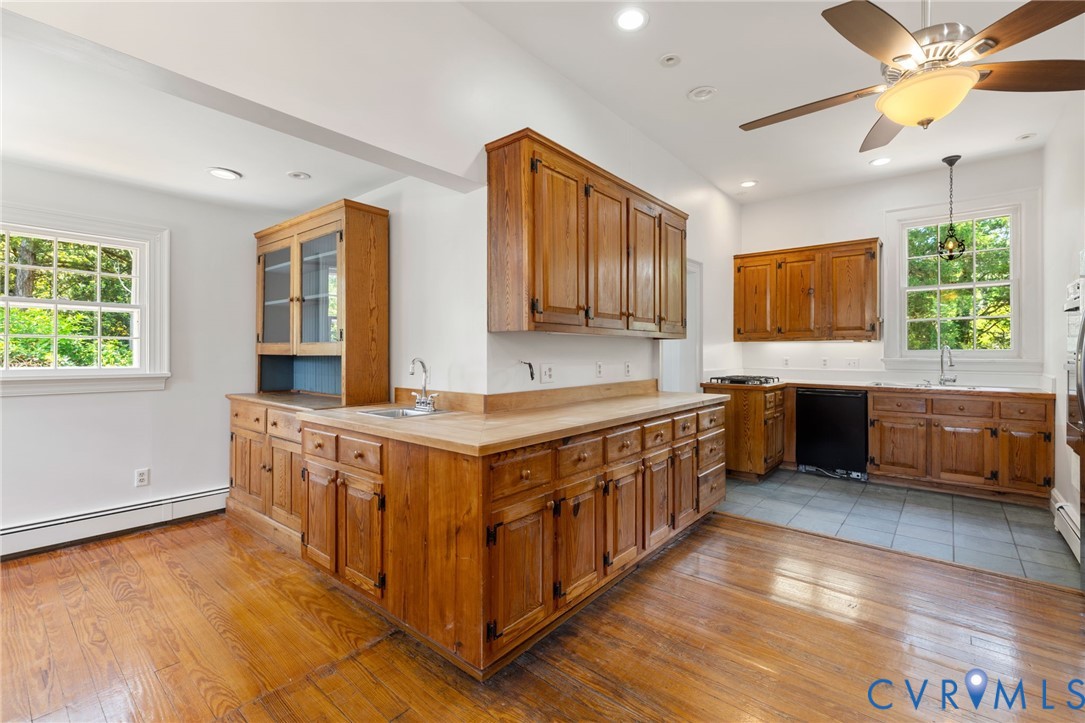 209 Ross Road Henrico, VA 23229 - Photo 22 of 43 Wood-finish flooring with tile flooring, wood cabi