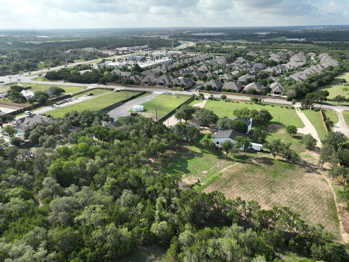 102 County Road 180 Leander, TX 78641 - Photo 8 of 25 Vast green spaces and a developed residential community intertwine, offering both serenity and accessibility.