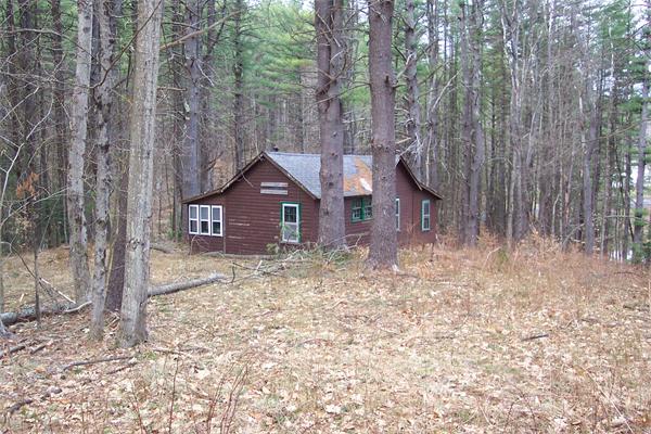 221 Zoar Road Rowe, MA 01367 - Photo 4 of 4 a view of a house with a yard and large tree