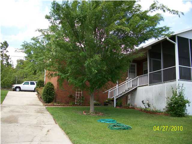 1584 Spring Lake Road DeFuniak Springs, FL 32433 - Photo 17 of 19 a view of a house with a yard