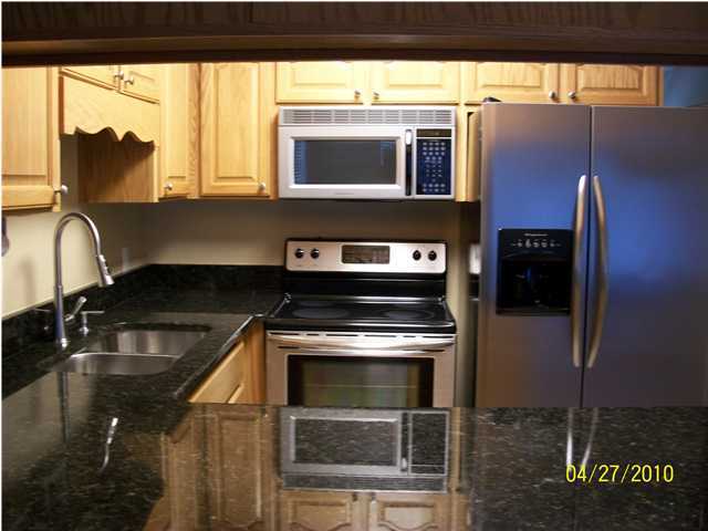 1584 Spring Lake Road DeFuniak Springs, FL 32433 - Photo 3 of 19 a kitchen with a sink and a stove