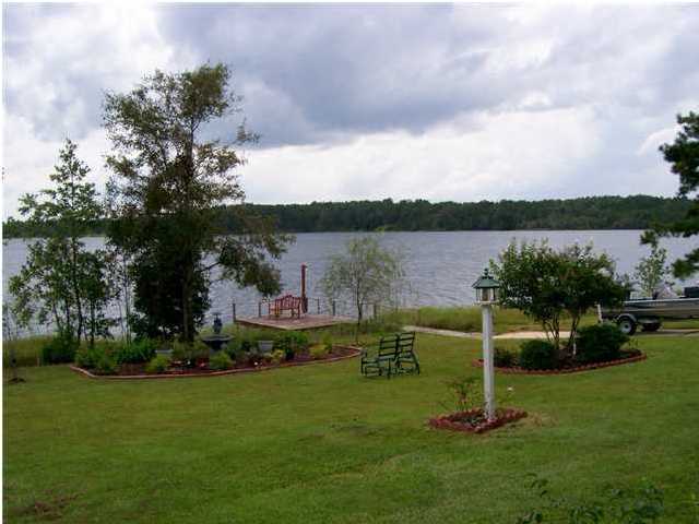 1584 Spring Lake Road DeFuniak Springs, FL 32433 - Photo 8 of 19 a view of a garden with houses
