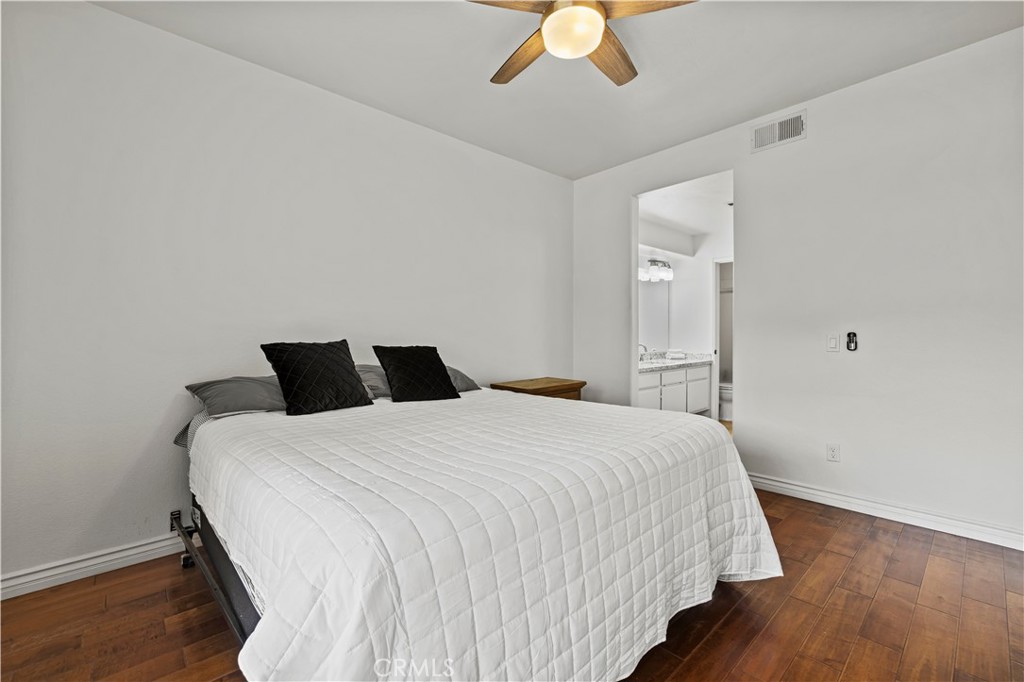 25518 Hemingway Avenue, Unit A Stevenson Ranch, CA 91381 - Photo 25 of 54 a bedroom with a bed and a chandelier