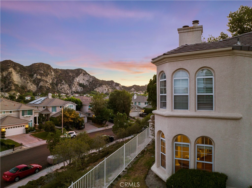 25518 Hemingway Avenue, Unit A Stevenson Ranch, CA 91381 - Photo 54 of 54 a front view of a house with a yard