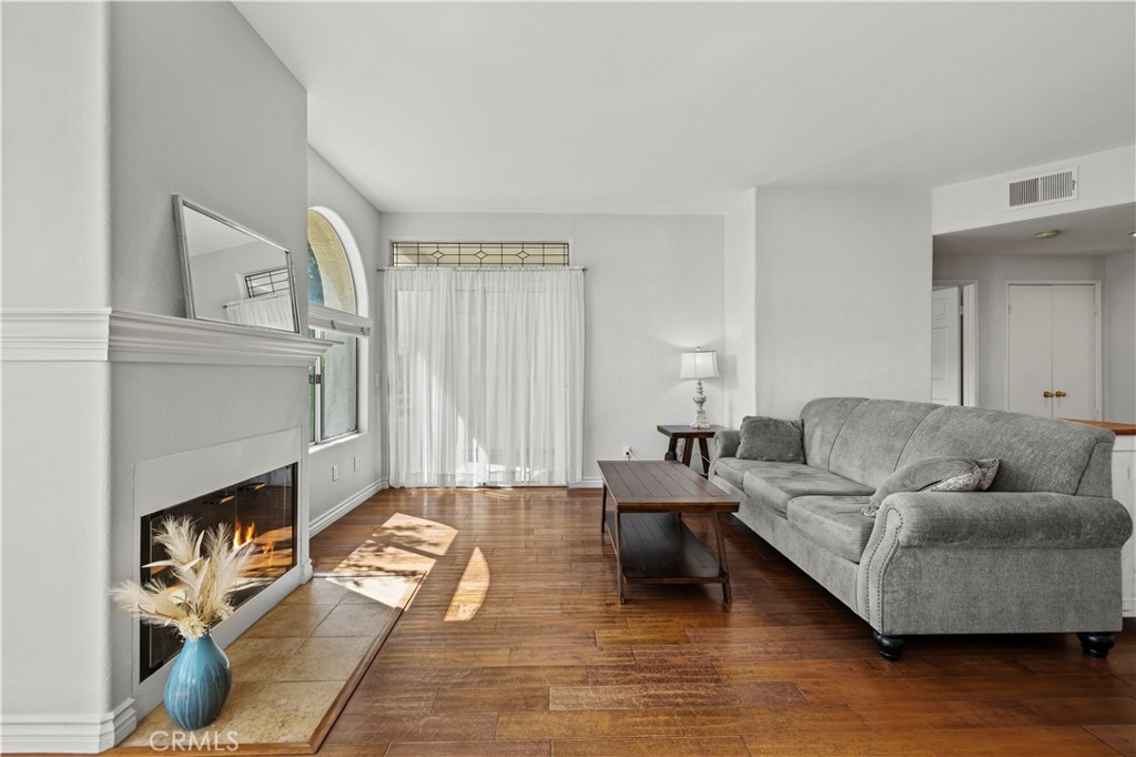 25518 Hemingway Avenue, Unit A Stevenson Ranch, CA 91381 - Photo 10 of 54 a living room with furniture and a wooden floor