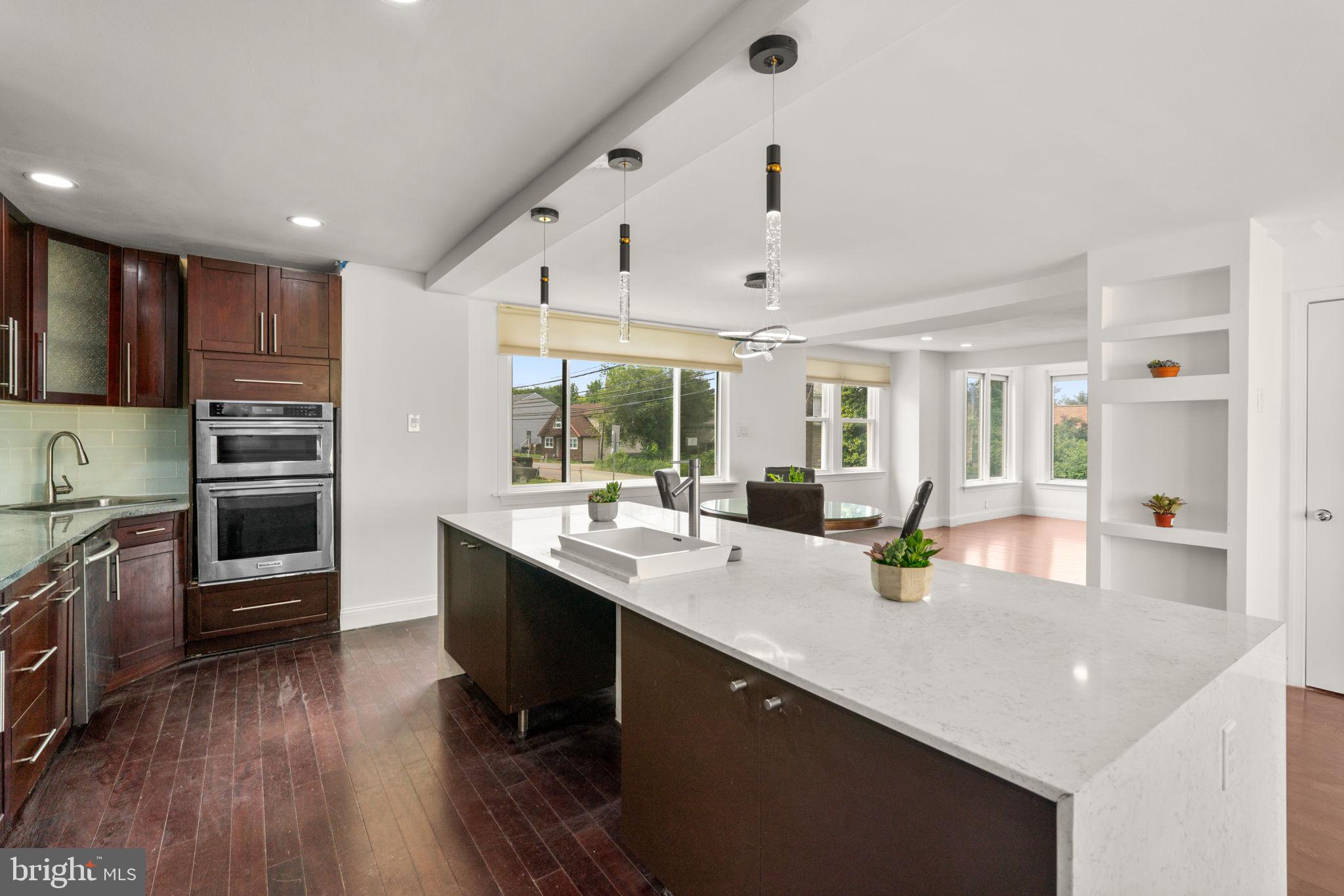 800 North Point Road Baltimore, MD 21224 - Photo 13 of 40 a kitchen with stainless steel appliances granite countertop a sink a stove and refrigerator