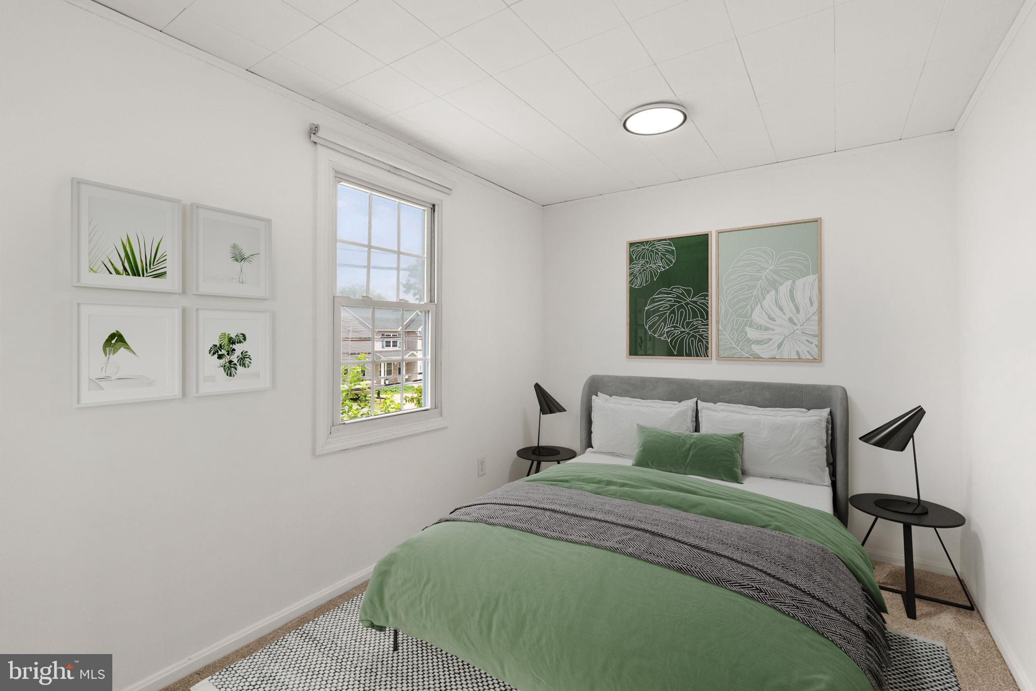 800 North Point Road Baltimore, MD 21224 - Photo 17 of 40 a bedroom with a bed and a window