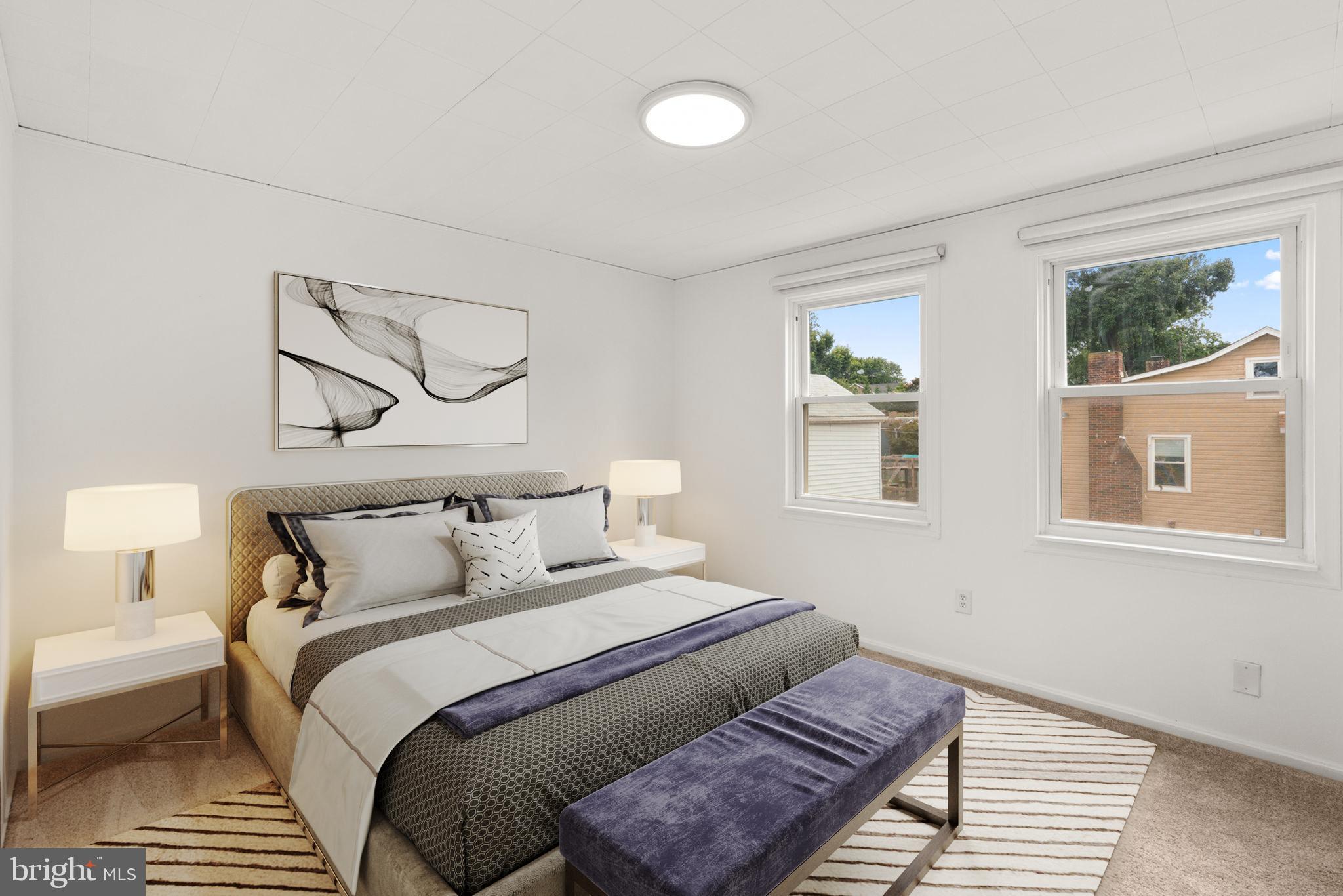 800 North Point Road Baltimore, MD 21224 - Photo 20 of 40 a bedroom with bed and wooden floor