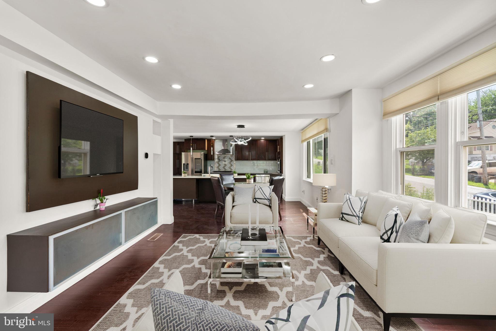 800 North Point Road Baltimore, MD 21224 - Photo 2 of 40 a living room with furniture and a flat screen tv