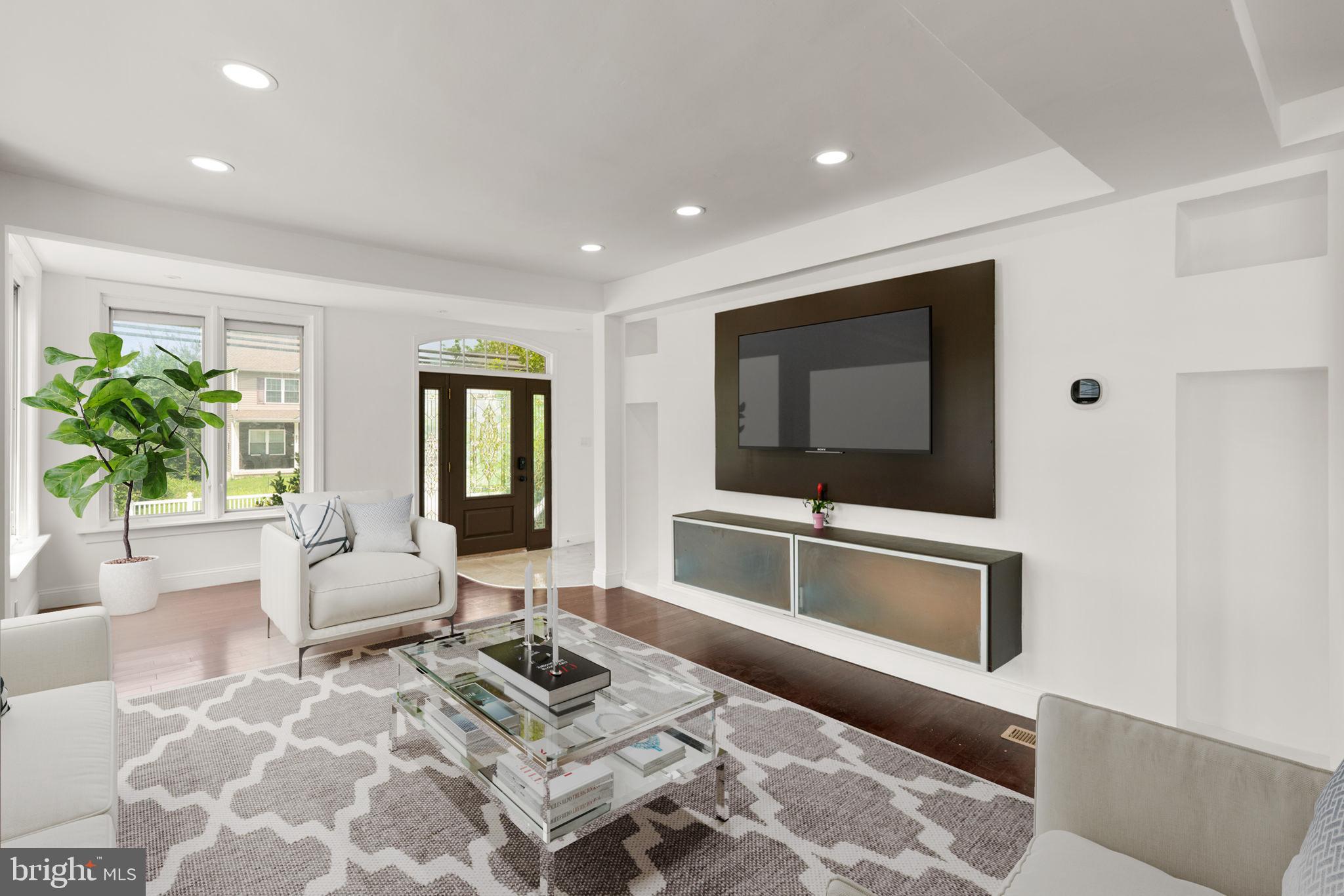 800 North Point Road Baltimore, MD 21224 - Photo 4 of 40 a living room with furniture and a flat screen tv