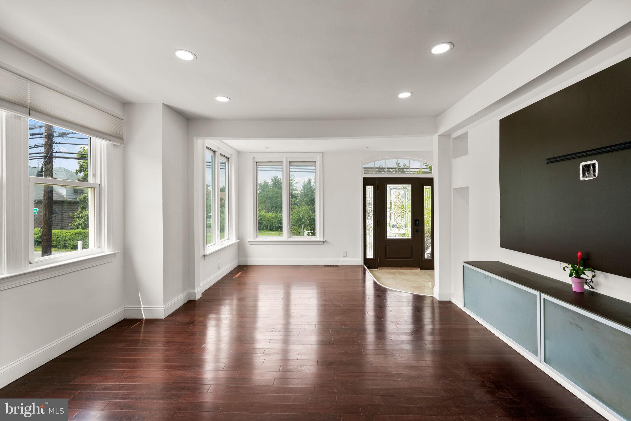 800 North Point Road Baltimore, MD 21224 - Photo 7 of 40 a view of an empty room with wooden floor and a window