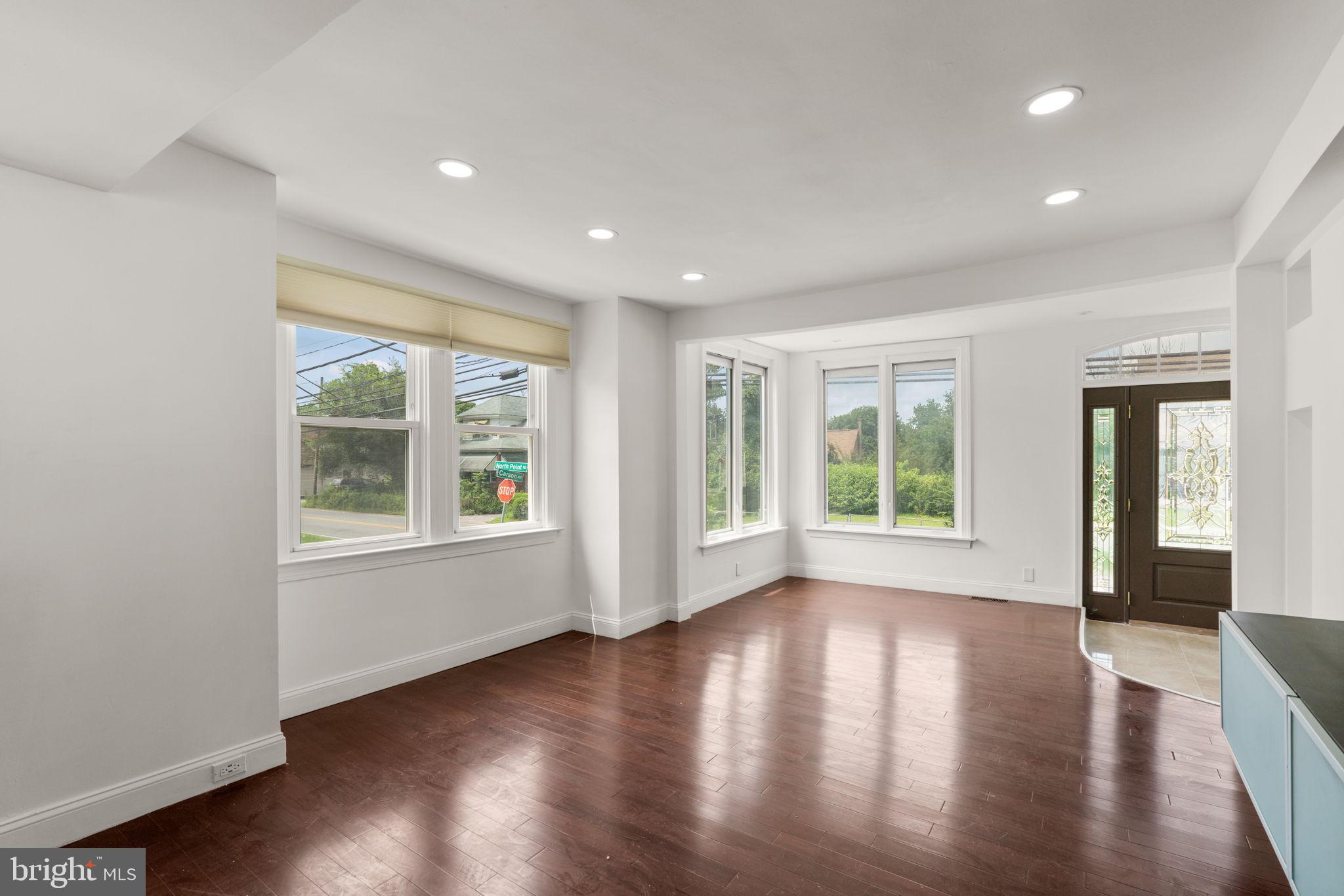 800 North Point Road Baltimore, MD 21224 - Photo 8 of 40 a view of empty room with wooden floor and fan