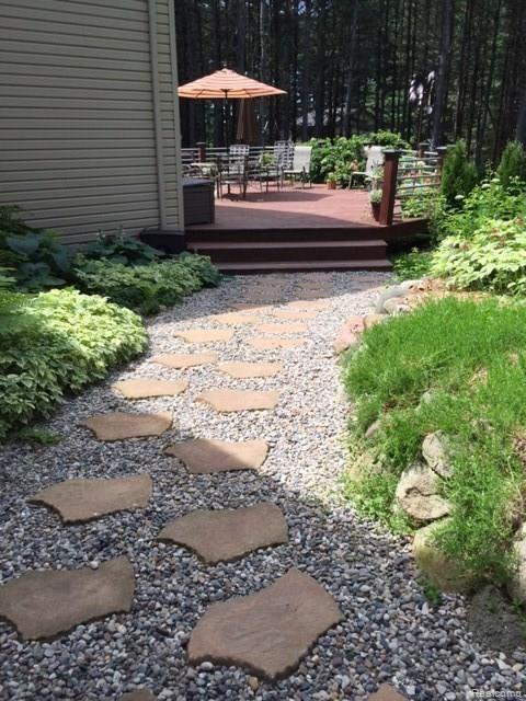 2251 Spruce Ridge Howell, MI 48855 - Photo 51 of 56 Walk way to the beautiful deck.