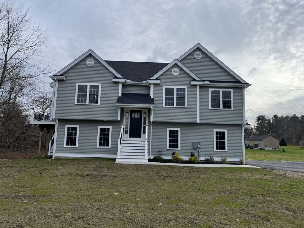 107 Putnam Hill Road Sutton, MA 01590 - Photo 1 of 21 a front view of a house with a yard