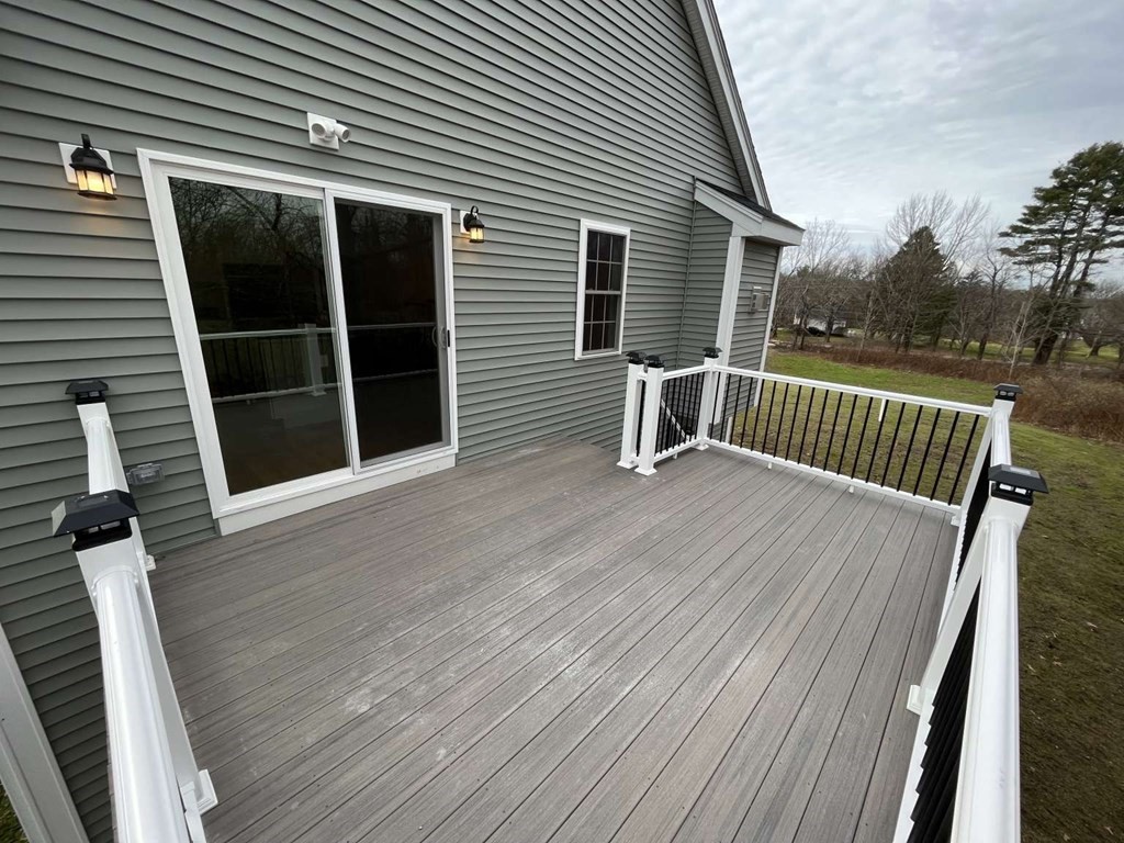 107 Putnam Hill Road Sutton, MA 01590 - Photo 11 of 21 a view of backyard with deck and wooden floor