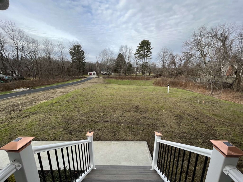 107 Putnam Hill Road Sutton, MA 01590 - Photo 20 of 21 a view of a yard with wooden fence