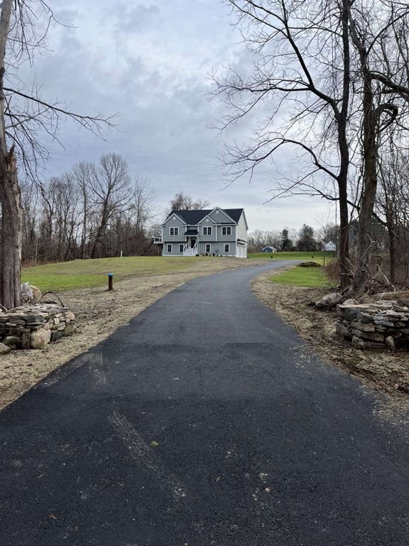 107 Putnam Hill Road Sutton, MA 01590 - Photo 2 of 21 a big yard with lots of green space and trees