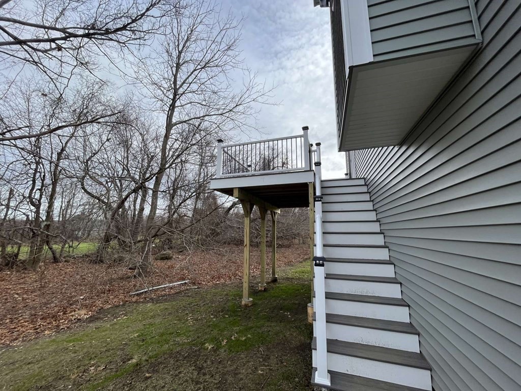 107 Putnam Hill Road Sutton, MA 01590 - Photo 21 of 21 a view of a house with a back yard